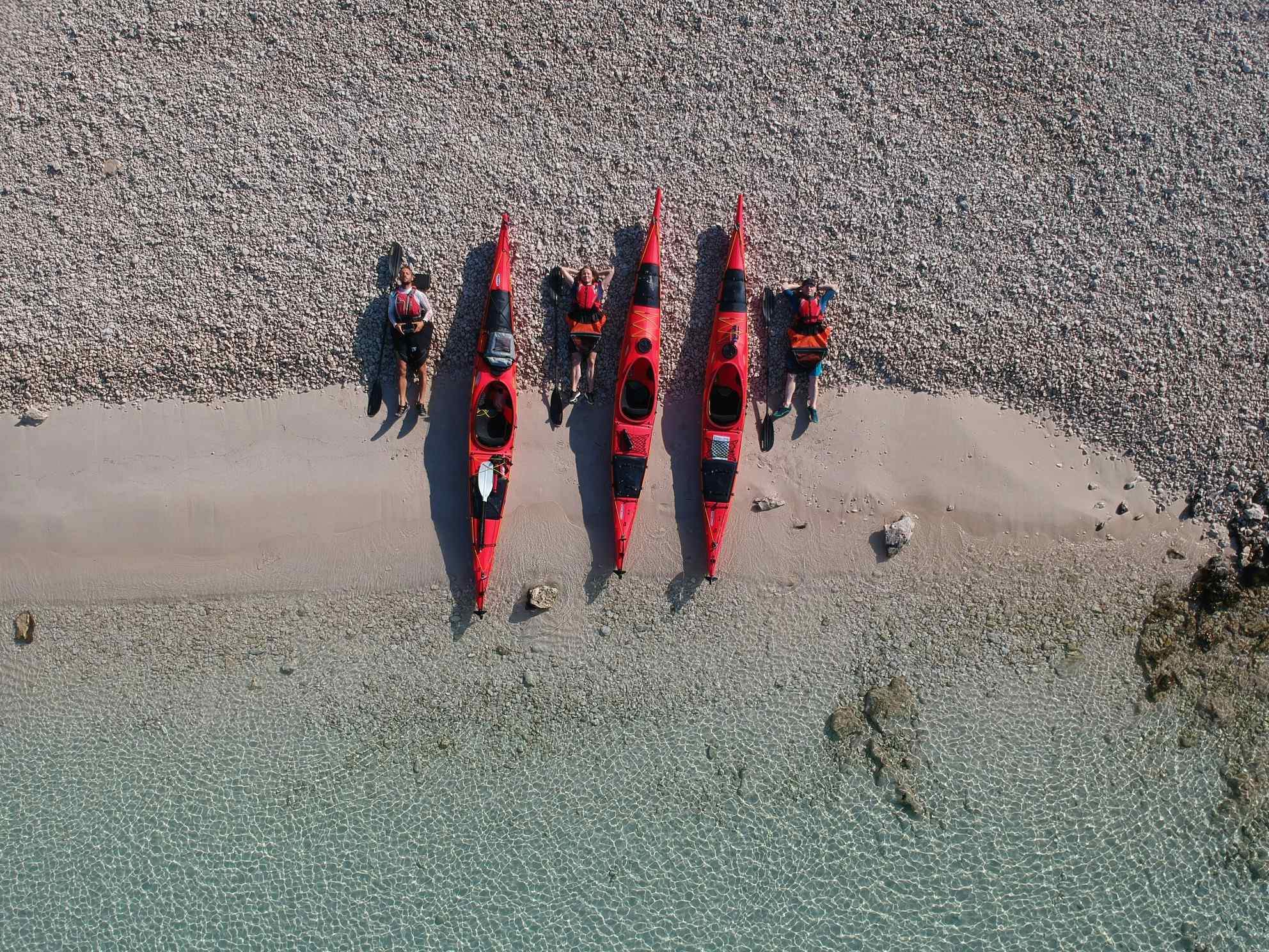 Group kayaking at beach, Croatia. Photo: Host/Red Adventure