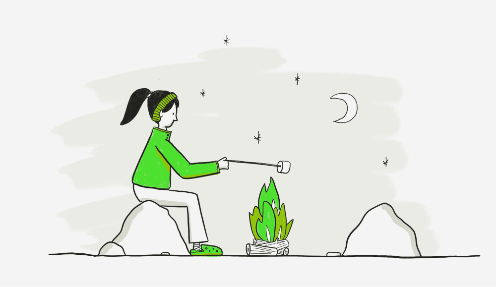 Person sitting by a campfire