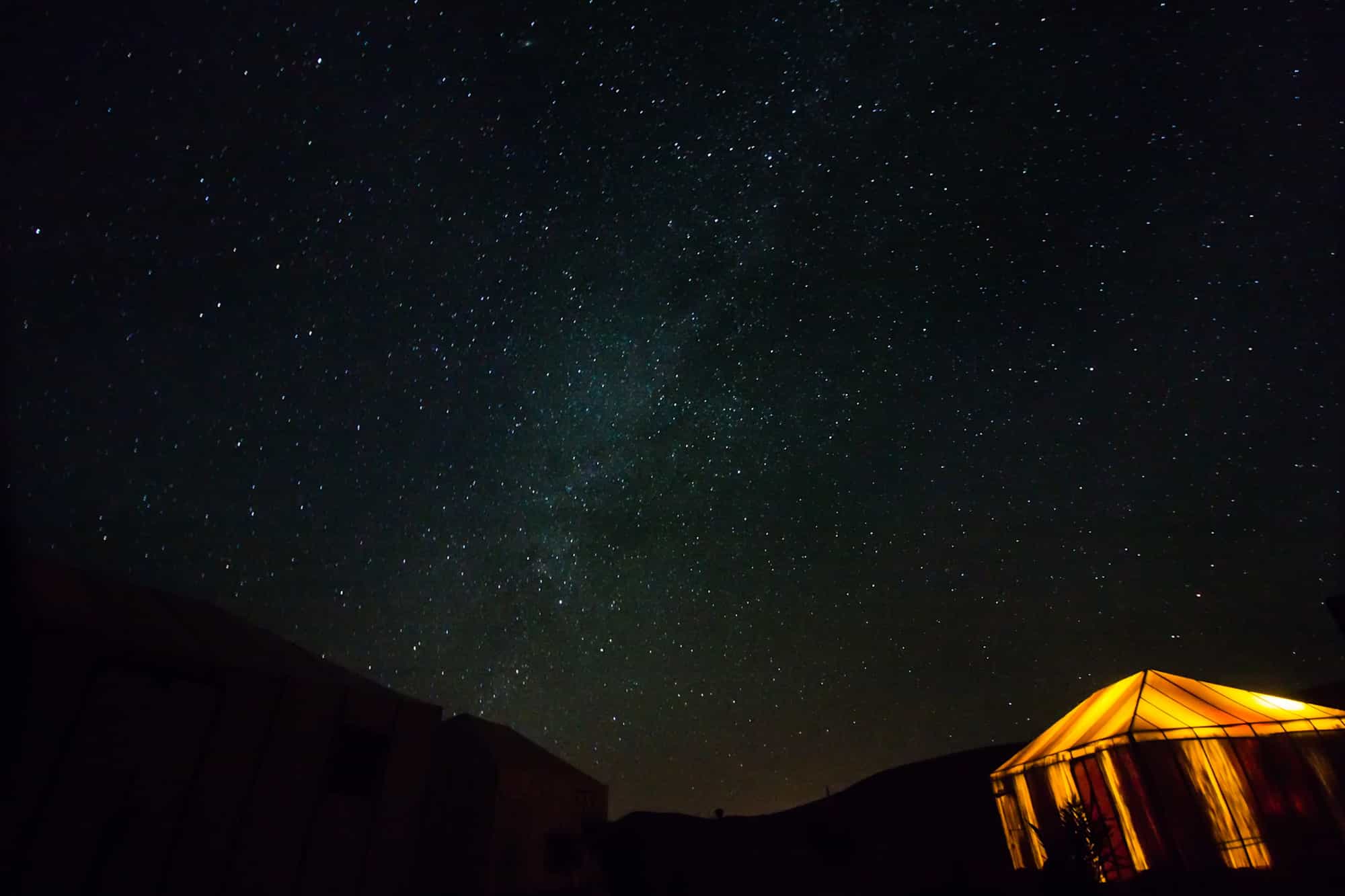Camping in sahara desert under stars in night