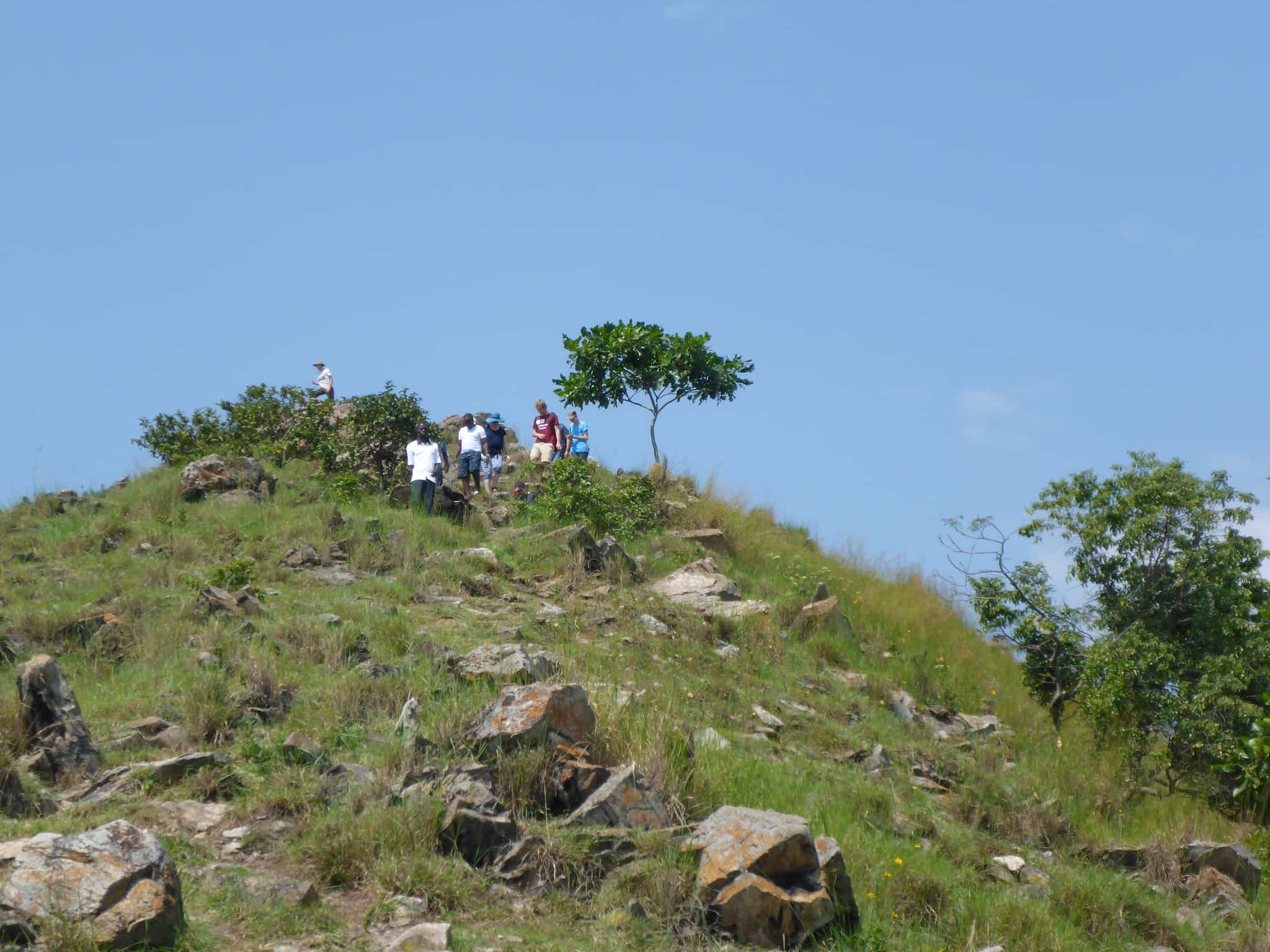 A group hikes to the top of Napoleon Island, Lake Kivu.