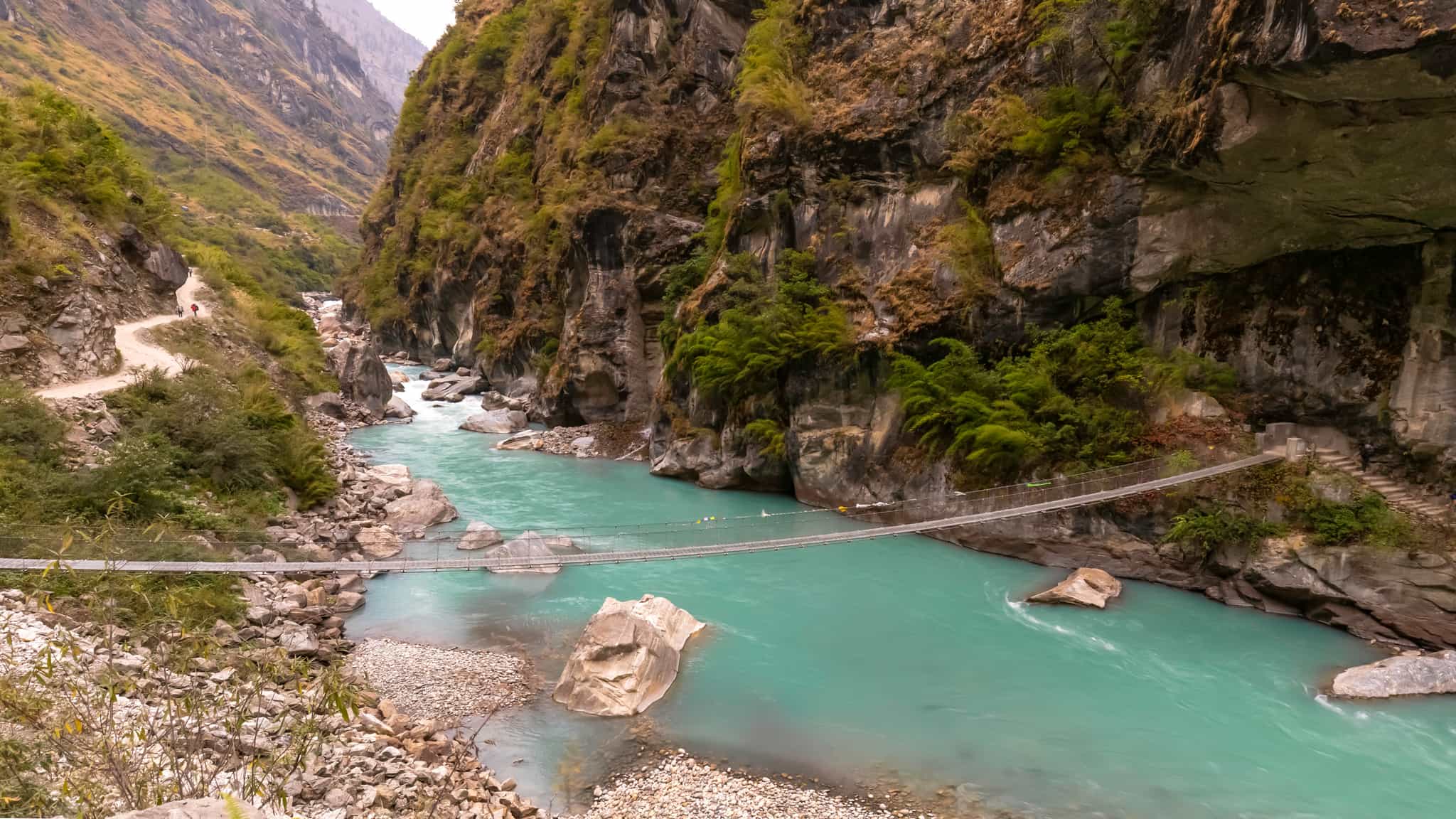 Rope bridge crossing the Marshyangdi River, Nepal.