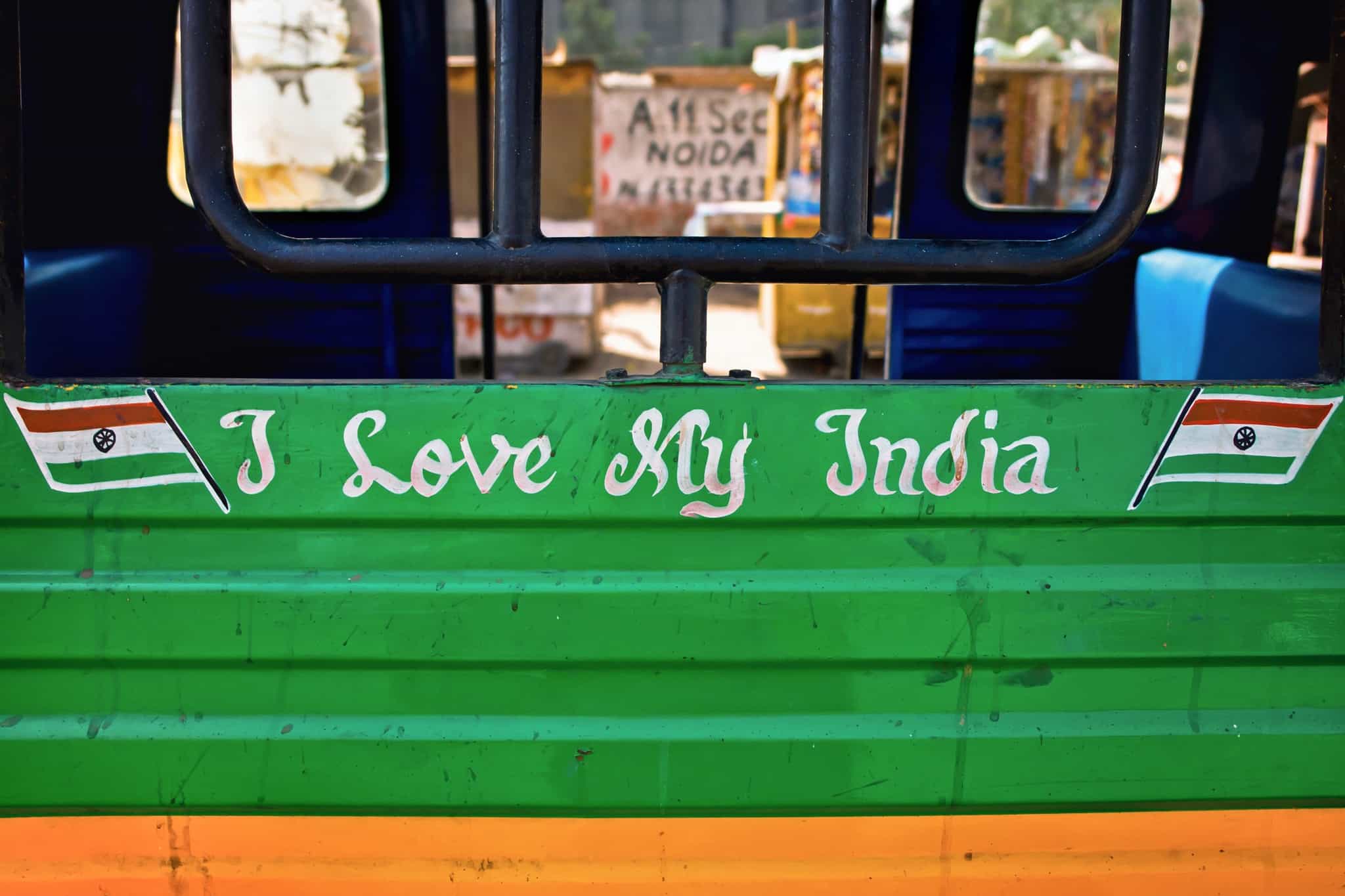 India bus motto. Photo. Canva Link :https://www.canva.com/photos/MAFZXLBodJc-closeup-shot-of-a-green-bus-with-the-writing-of-i-love-my-india-on-it/