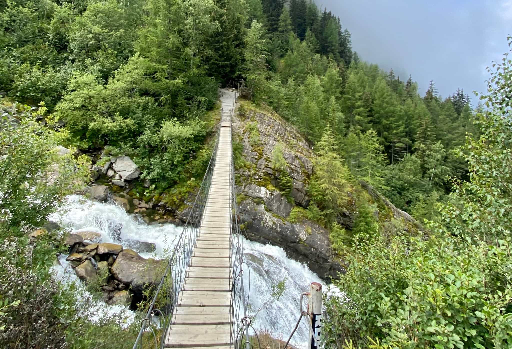 TMB Day 1: Suspension Bridge near the Glacier de Bionnassay | Photo: Host - Happy Tracks