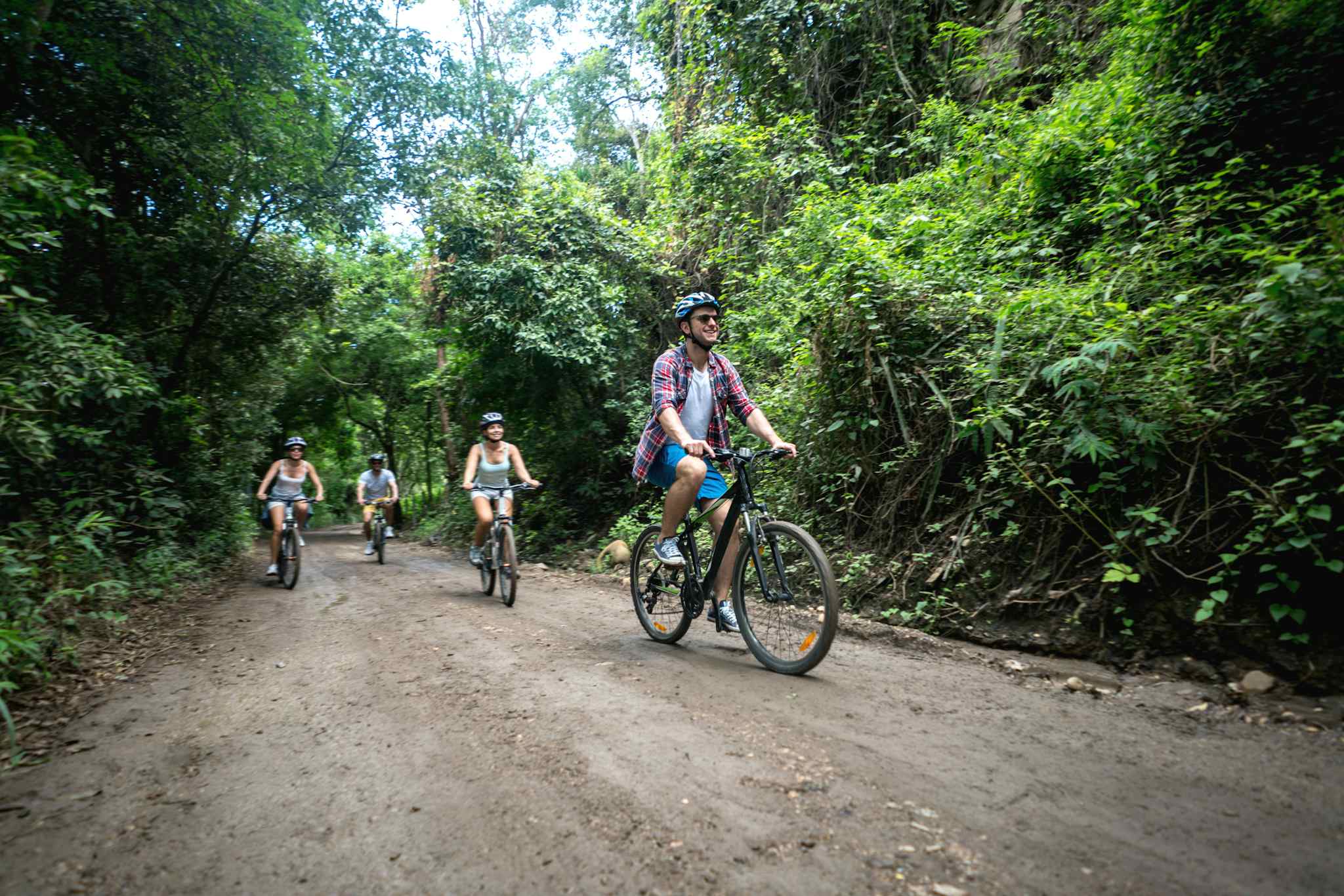 Cyclists, Dirt Road, Colombia, Getty