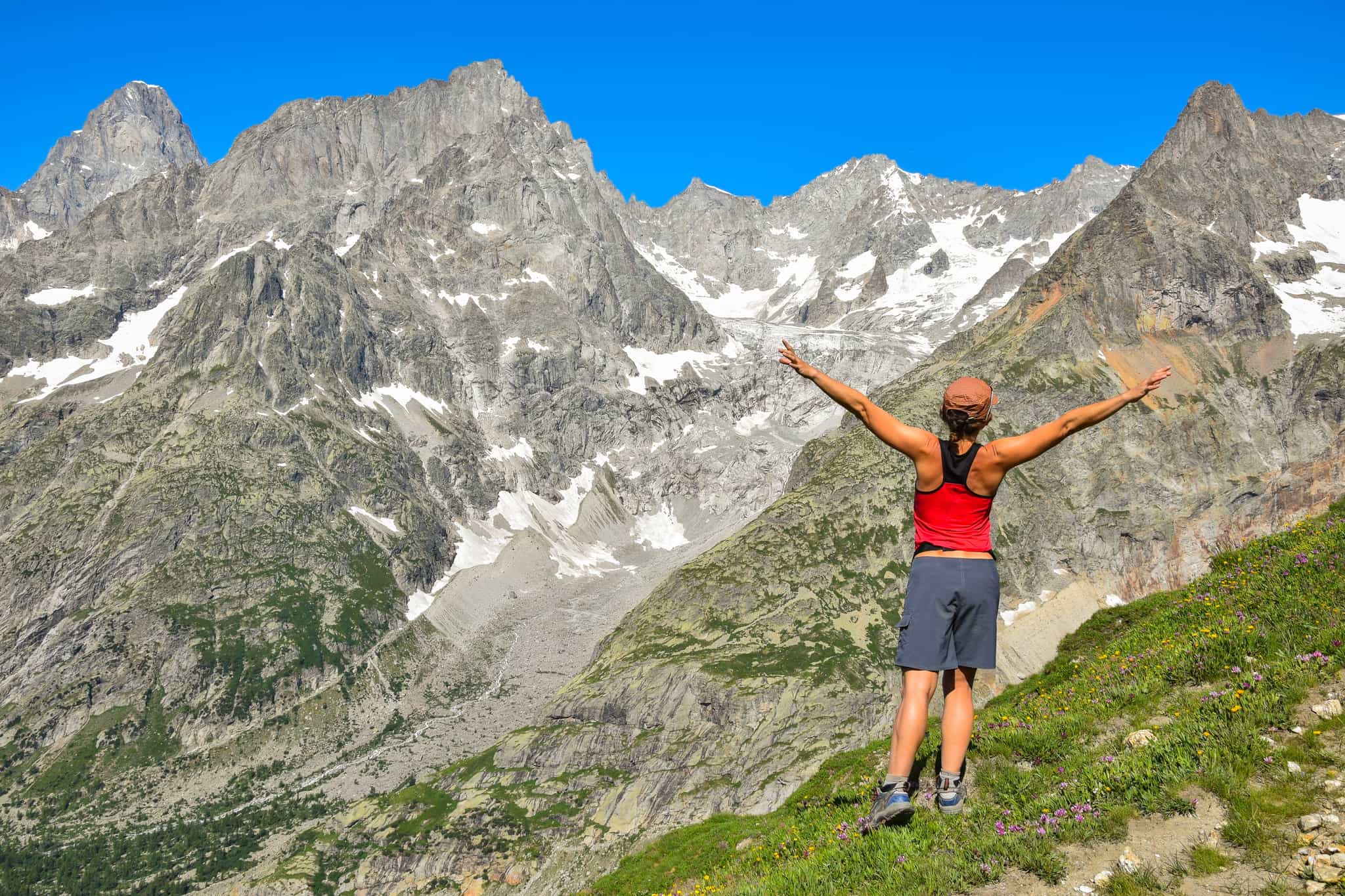 Hiker standing at the top of the Col du Grand Ferret