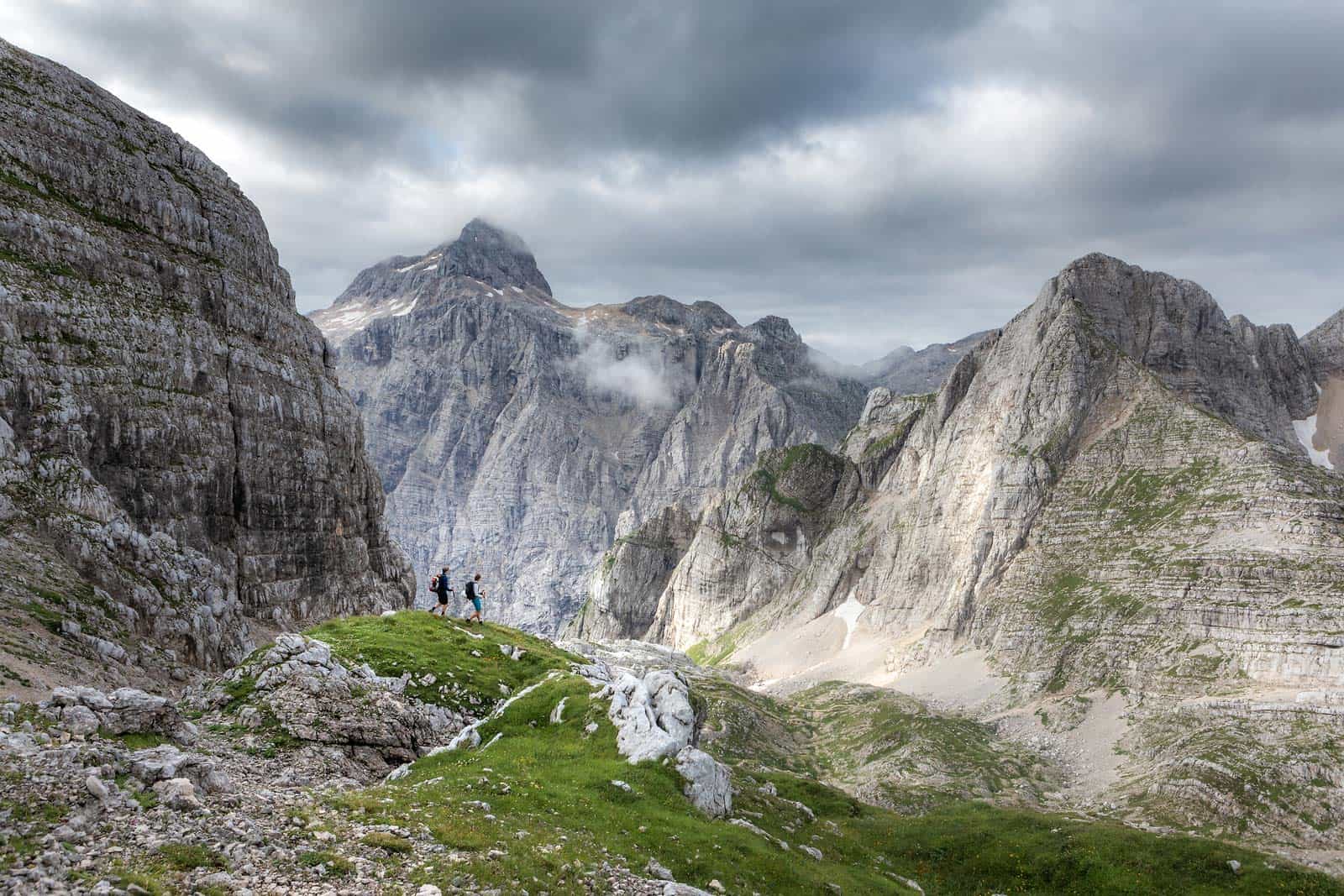 Hiking against a dramtic mountain backdrop in the Julian Alps