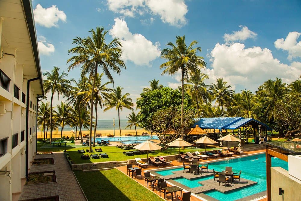 Garden and pool view. Camelot Beach Hotel, Negombo Sri Lanka