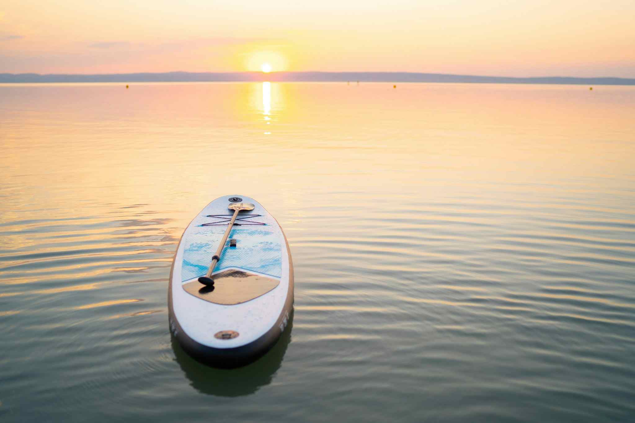 https://www.canva.com/photos/MAEECCwR-tQ-standup-paddle-board-on-empty-lake-in-sunset/