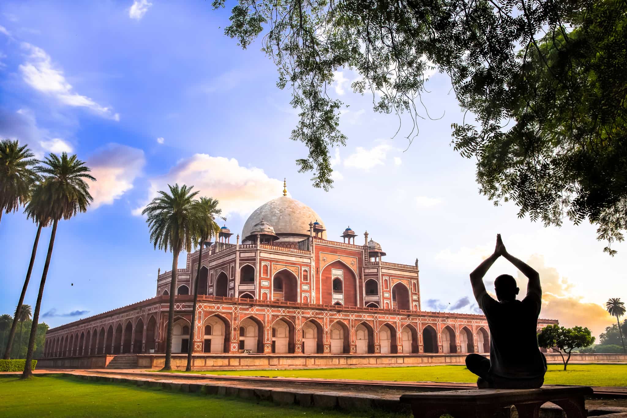 A man doing Yoga on the lawns of Humayun’s Tomb, Delhi.