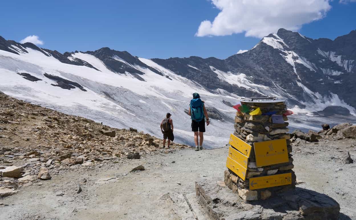 Hiker by Col Bassac Dere watching over Glairetta glacier.