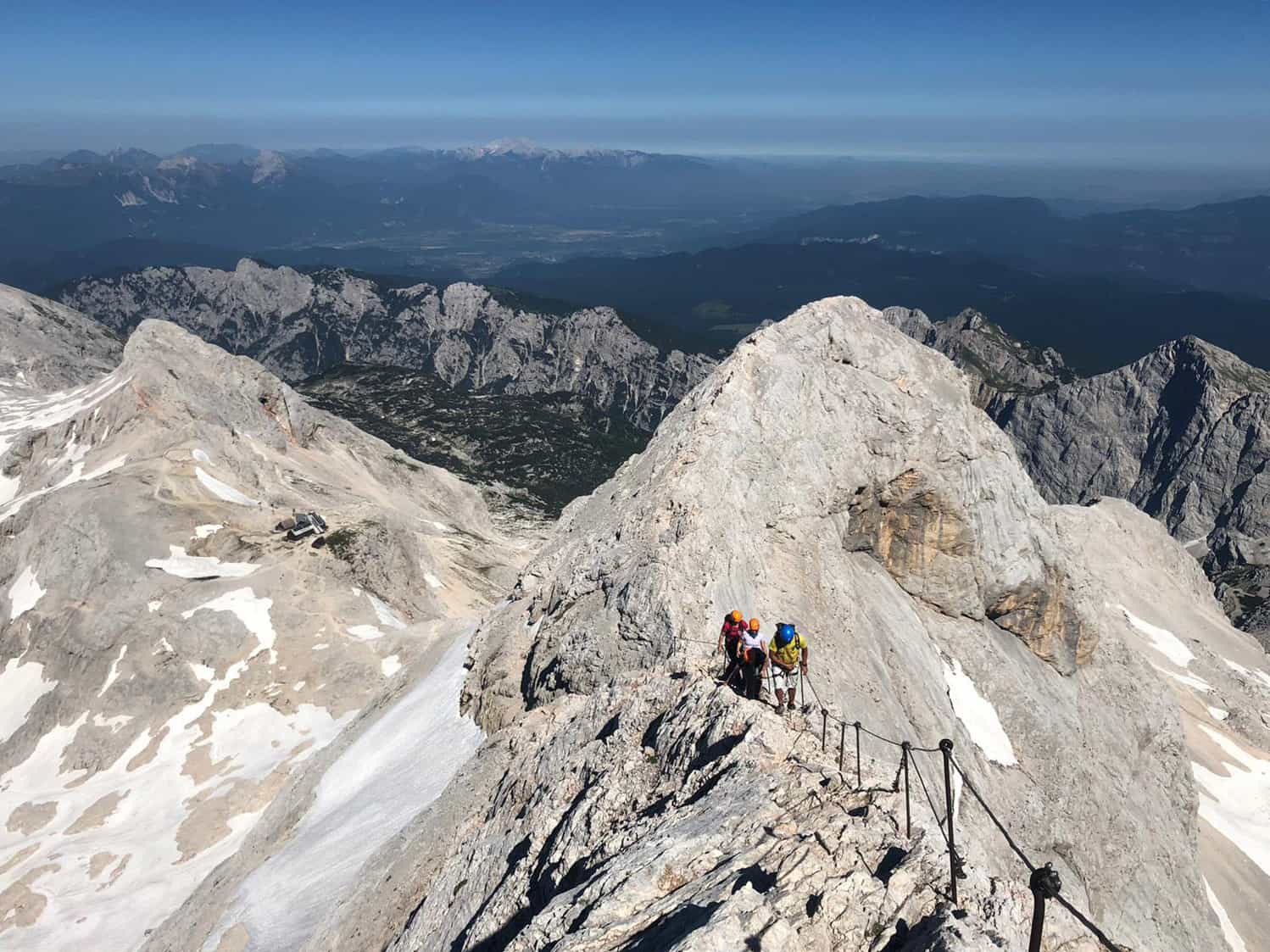 Hikers ascending the via ferrata on Mount Triglav, Slovenia.