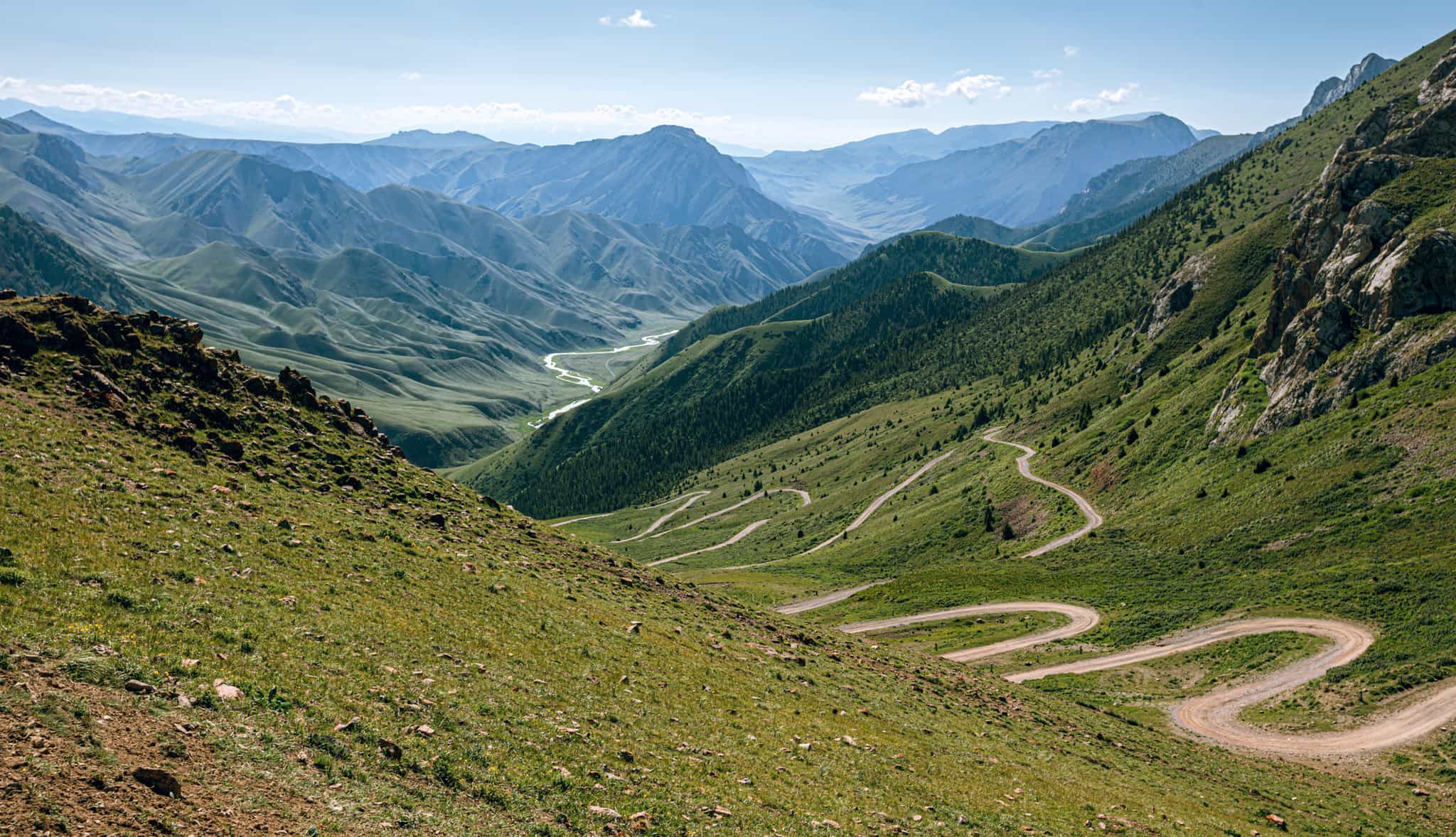 Pass and road below in summer in Kyrgyzstan