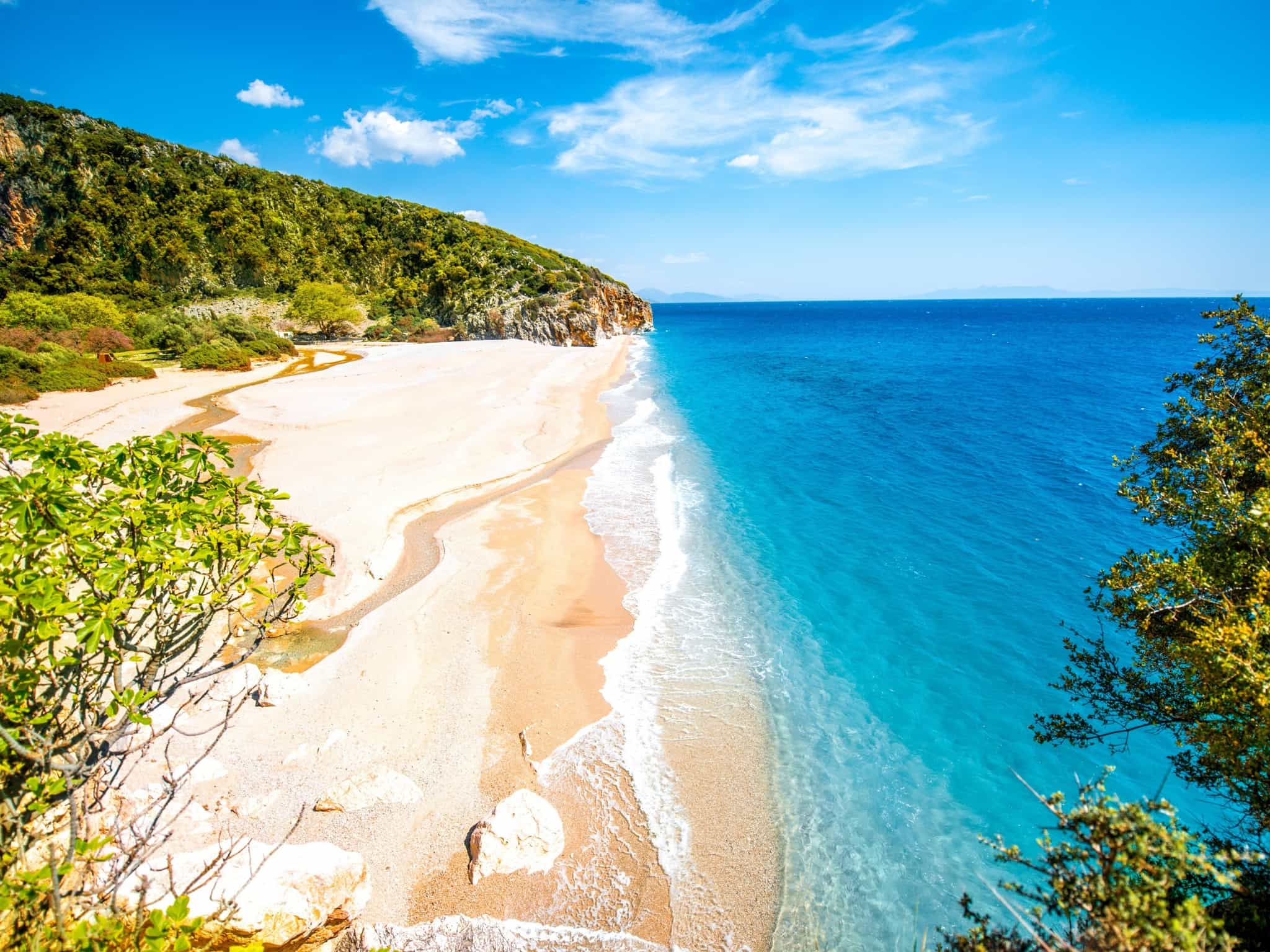 Gjipe beach with rocks and river,  Albania. Photo: GettyImages-472797134