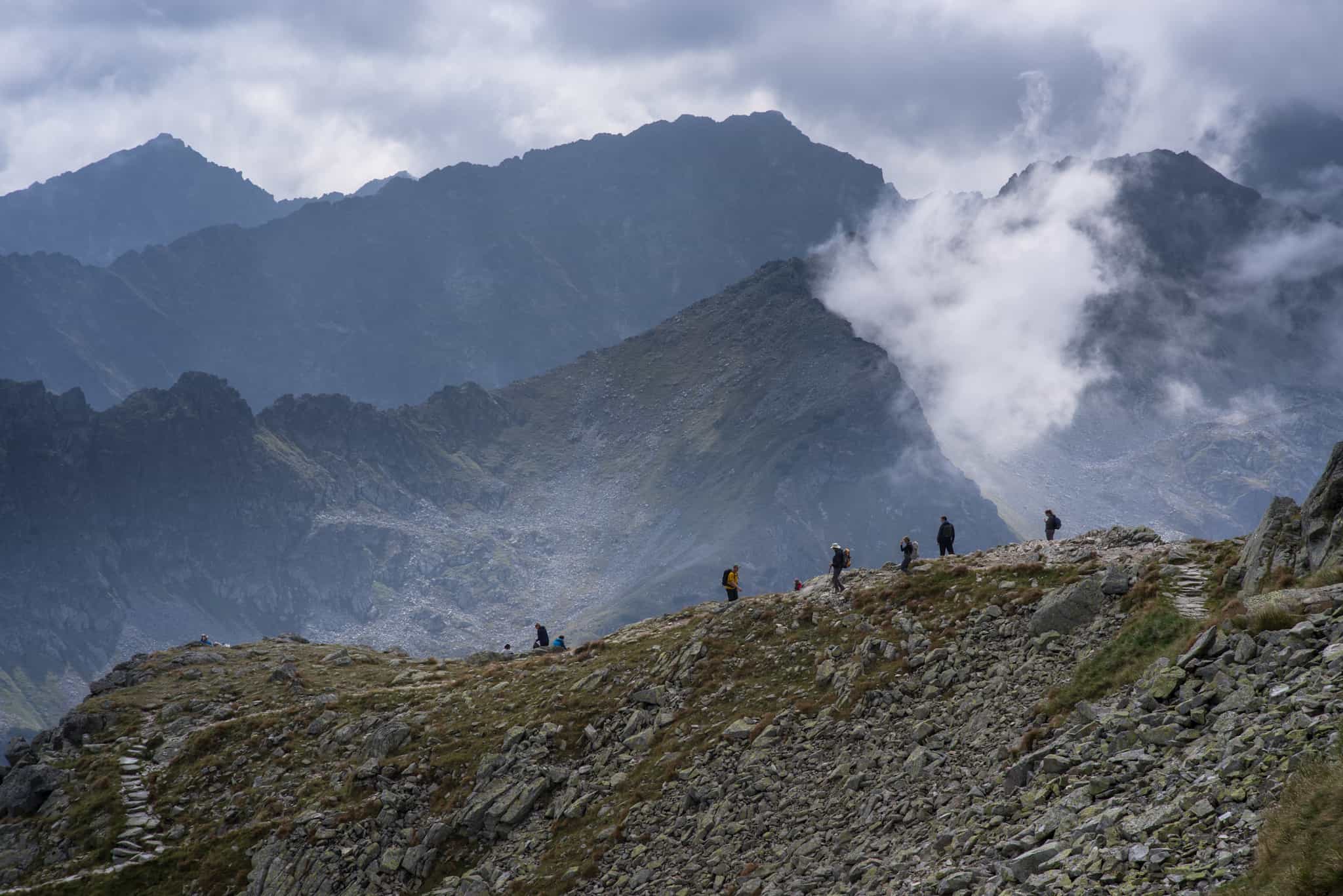 Hikers on a trail in the Five Lakes Valley in Poland's Tatra Mountains.