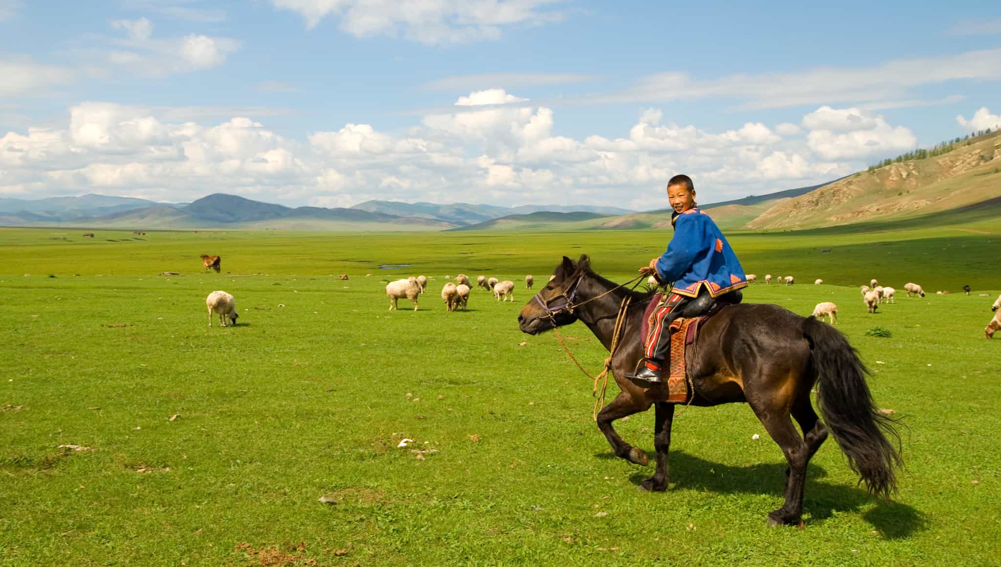 Local kid horse riding, Mongolia. Photo: GettyImages-170616400