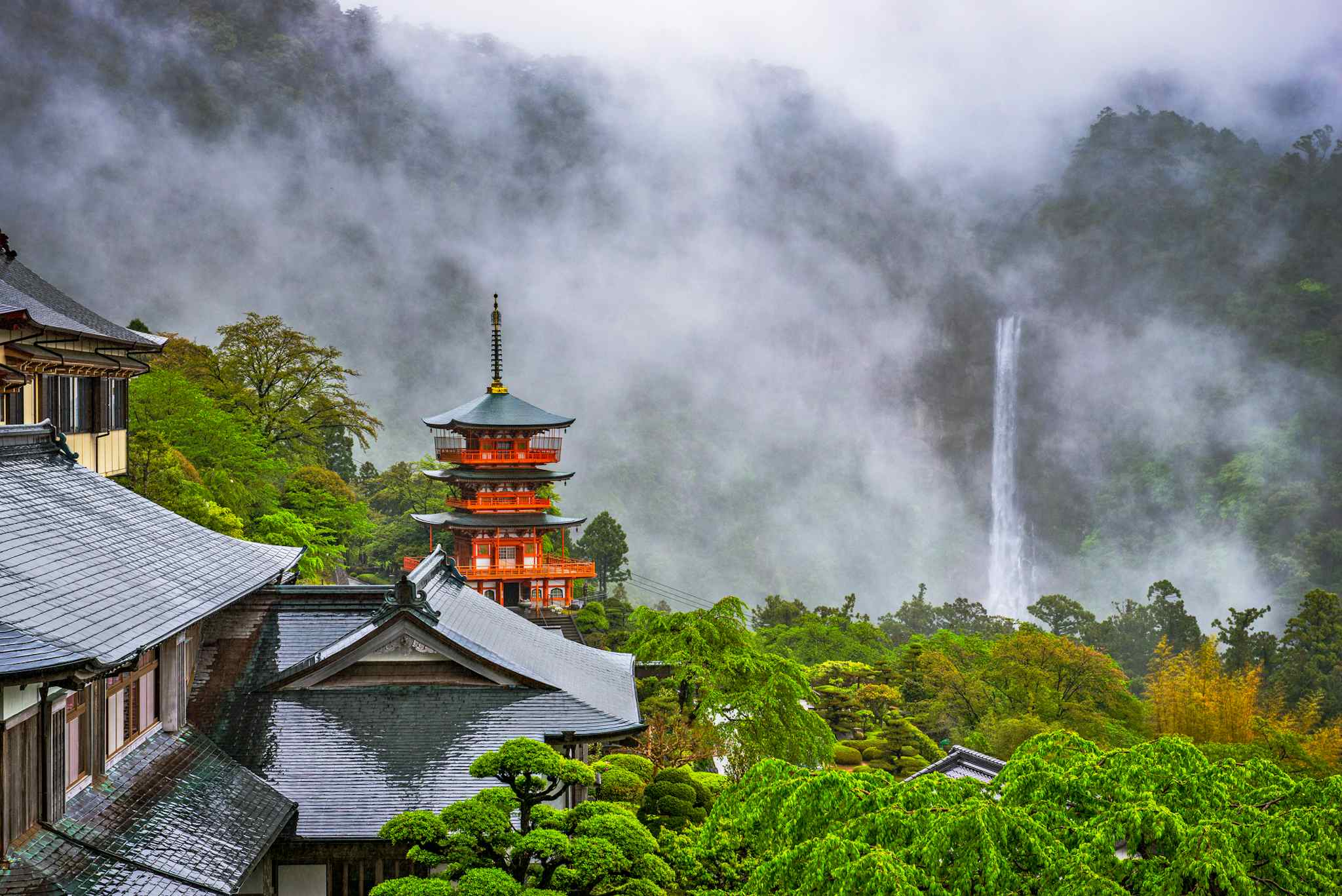 Three-story Sanjudo pagoda of Seiganto-ji temple and Nachi falls, Japan. Photo: GettyImages-1482248139