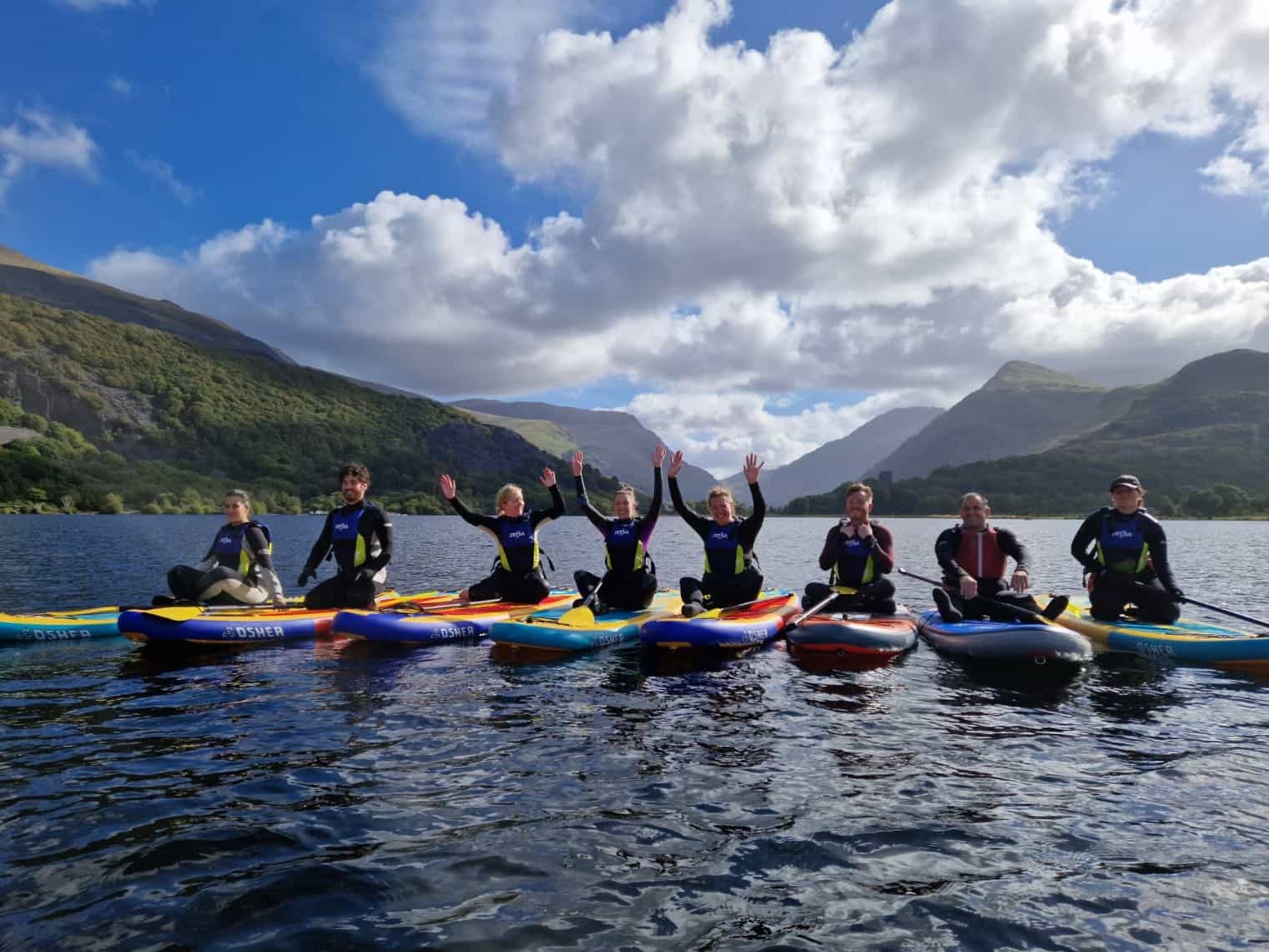 Stand-up paddleboarders on Llyn Padarn in Snowdonia (Eryri), Wales