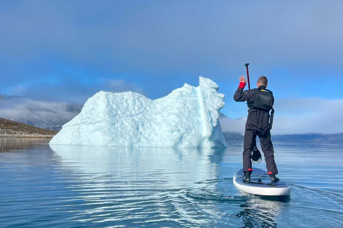 Paddleboarding next to a glacier in Itisoq, Greenland