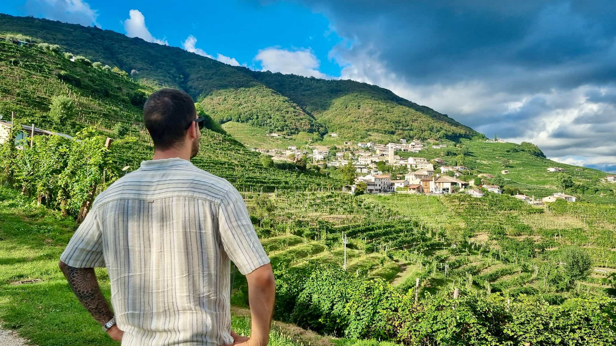 Man overlooking the Prosecco Hills panorama.