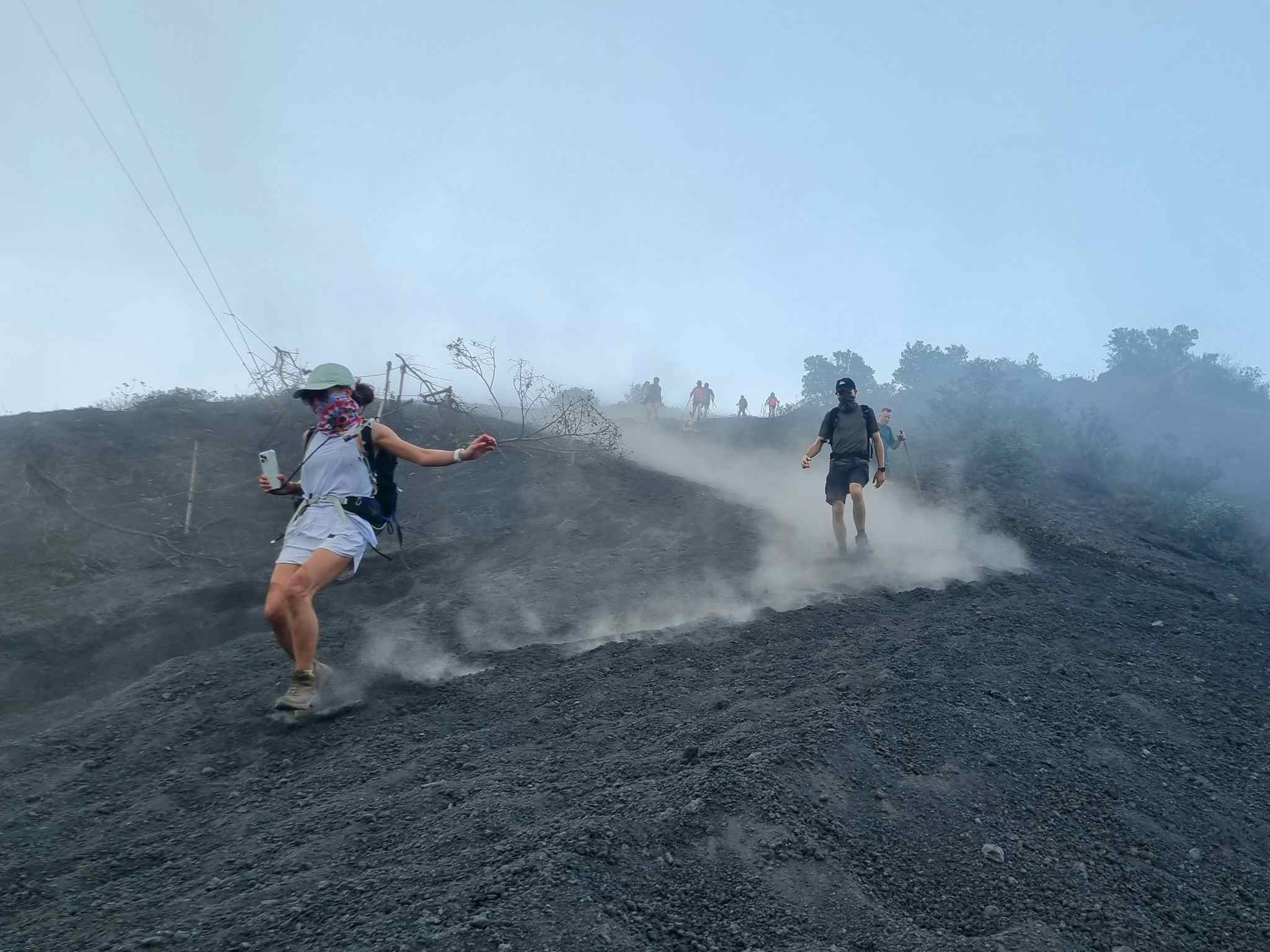 Two hikers descending Pacaya Volcano, Guatemala.