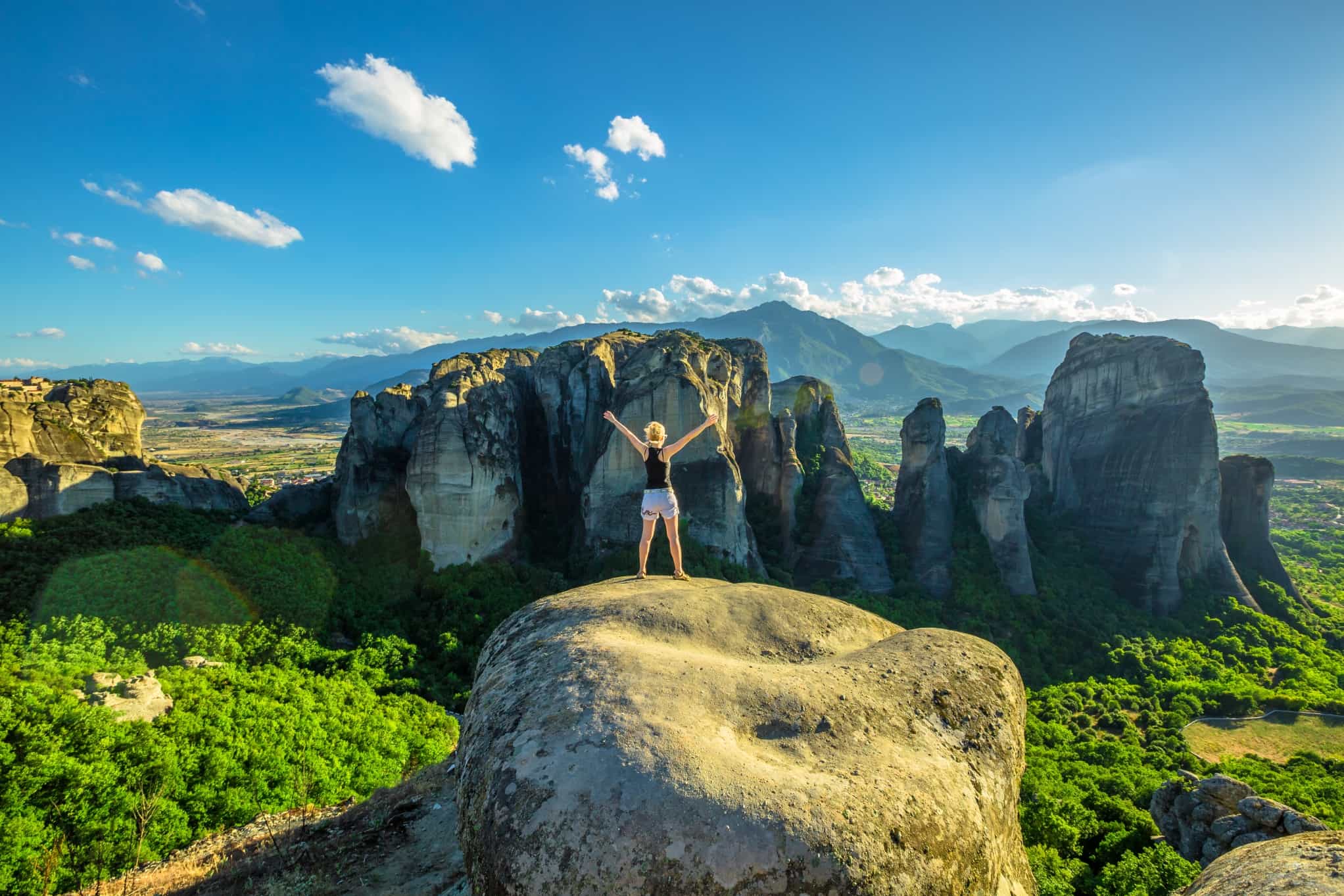 GETTY - Woman traveler enjoying spectacular Meteora landscape in Thessaly, Greece. Photo: Getty # 695936772