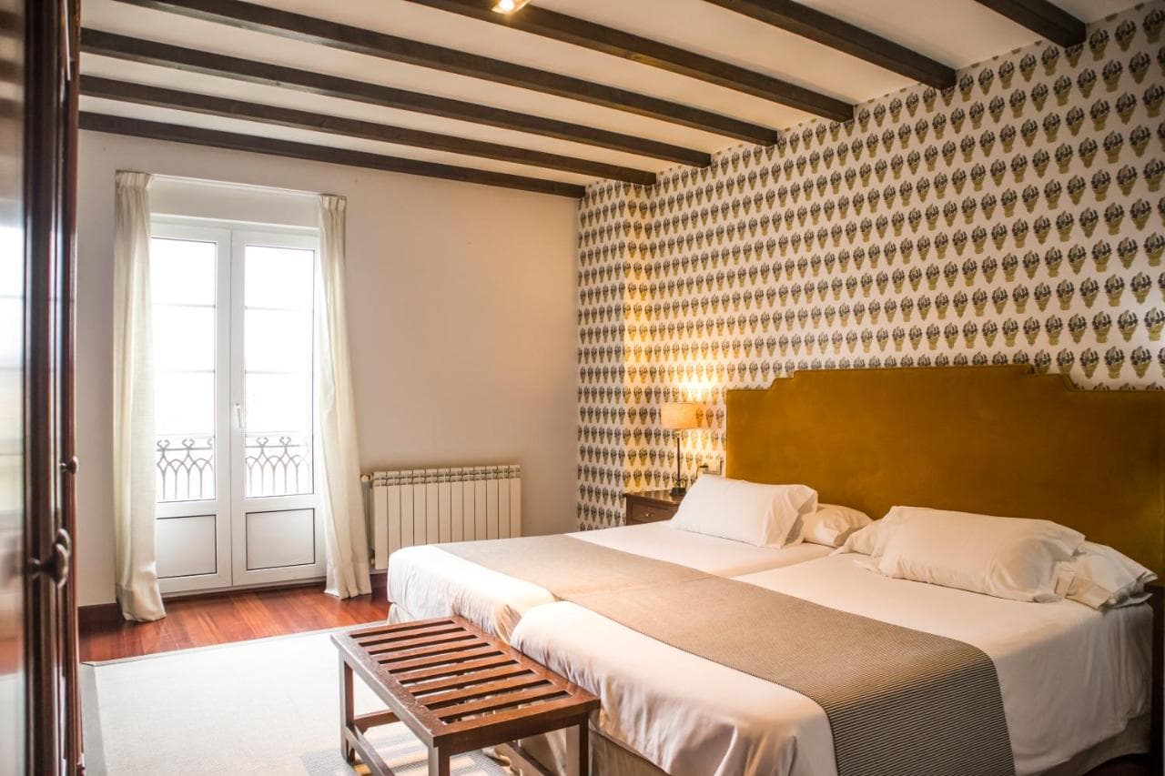 A bedroom with a double bed