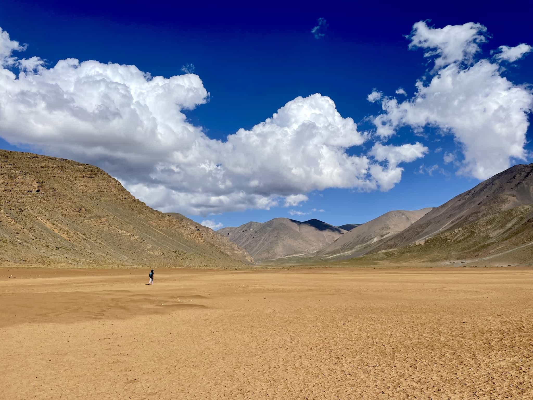 Person walking through a valley in the Atlas Mountains in Morocco
