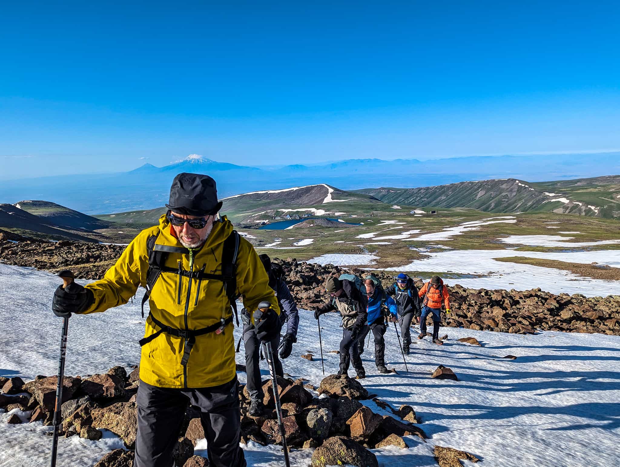 Group of trekkers climbing Mount Aragats in Armenia