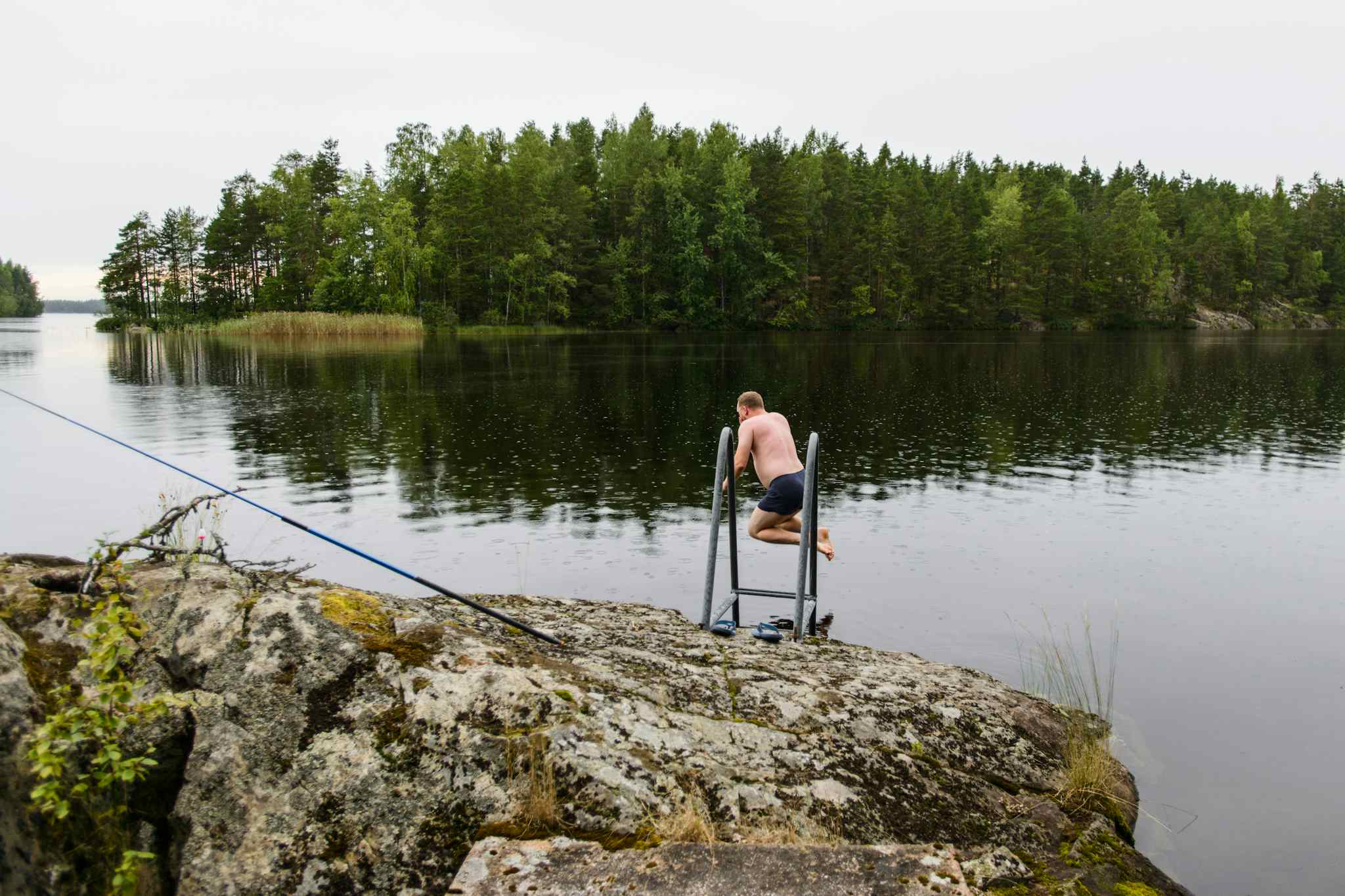 Man jumping in water after taking Finnish sauna. Photo: GettyImages-1130429204