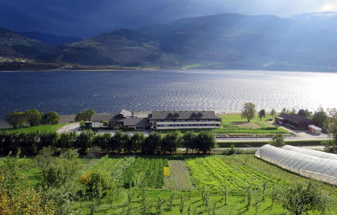 An aerial view of a hostel on the fjord edge in Voss, Norwegian Fjords. 