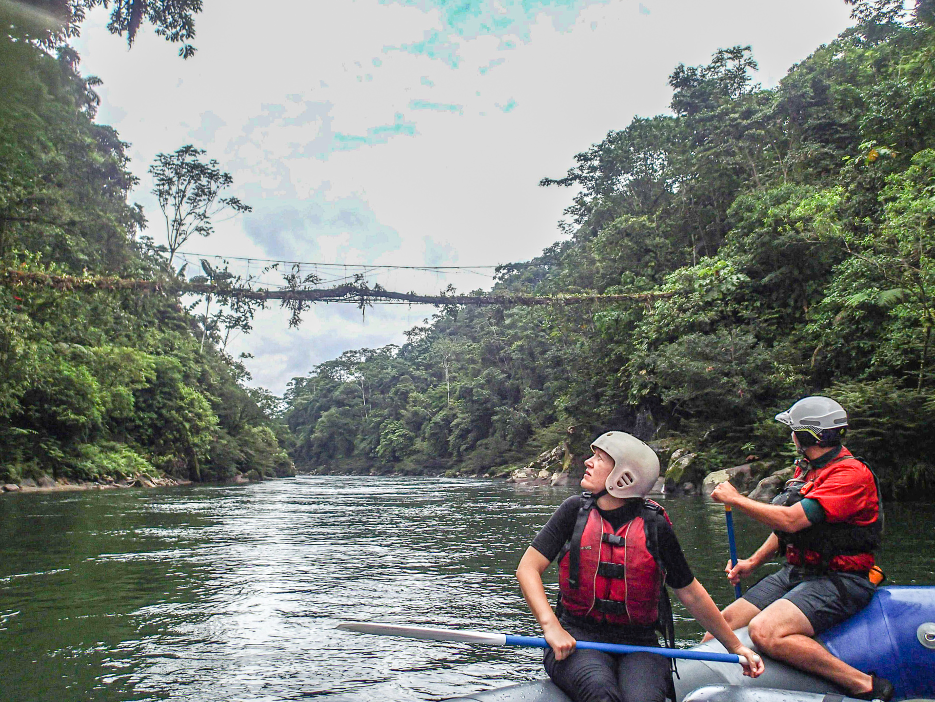 Two people raft the Jatun Yacu River in Ecuador's Amazon Basin. 
