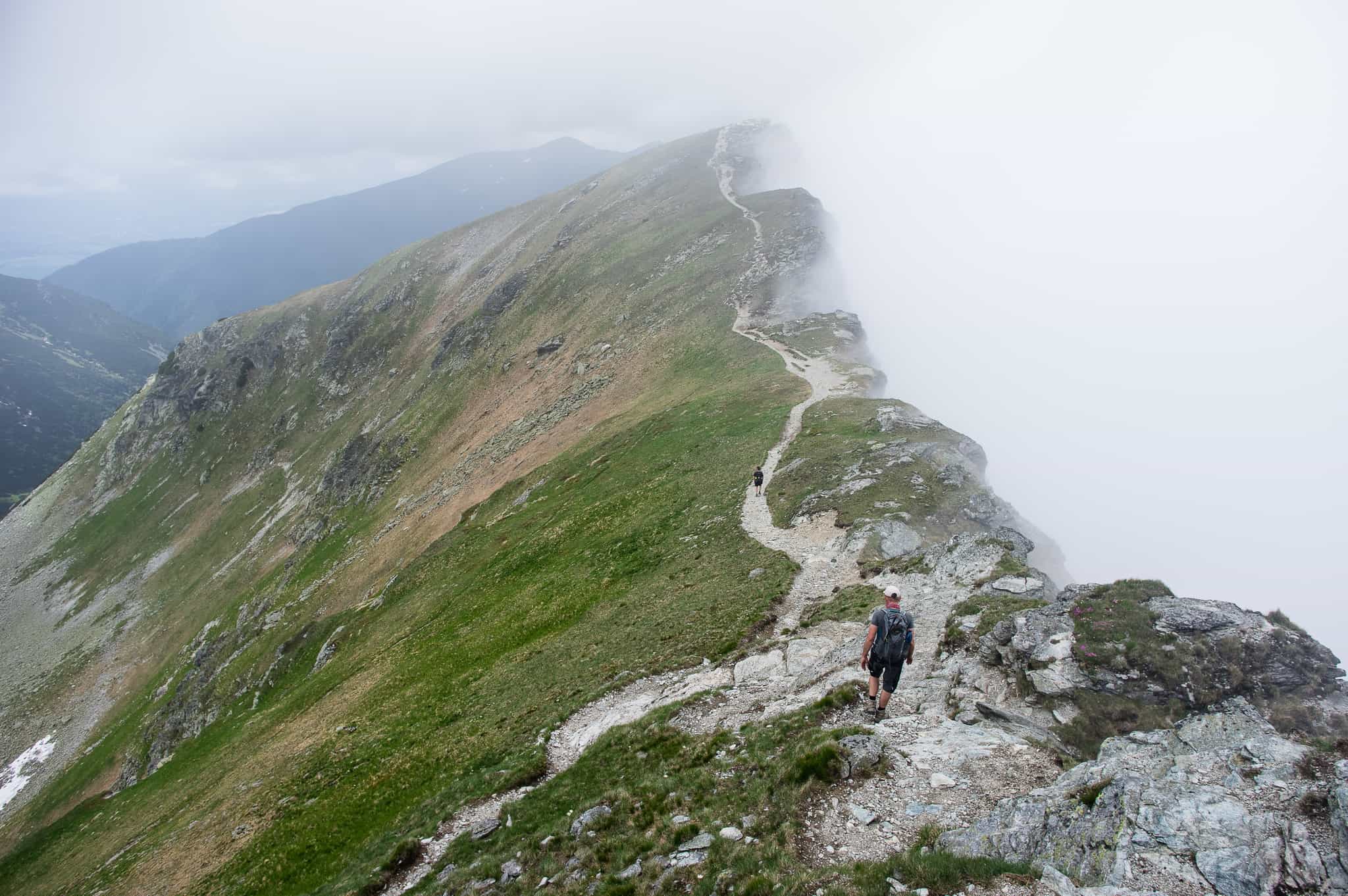 2 hikers walk along a ridge in the Western Tatra Mountains