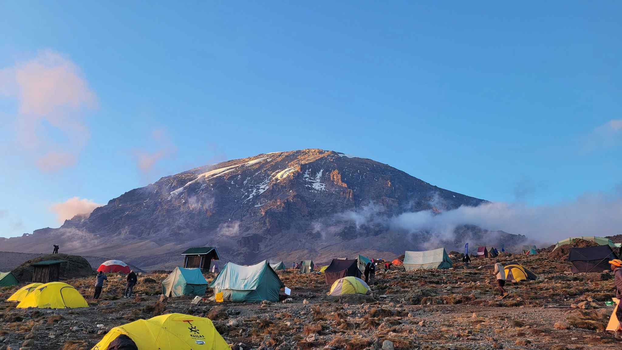 View of Karanga Camp with the summit of Mount Kilimanjaro in the background, Tanzania.