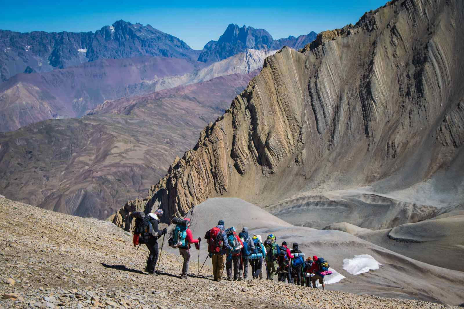 Group descending hill, Andes-Vertical