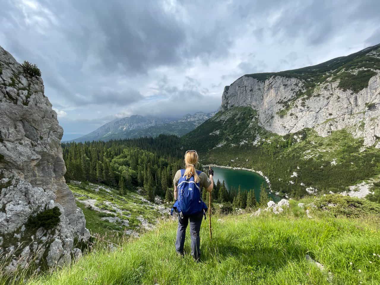Female hiker approaching Crvena Greda, Montenegro.