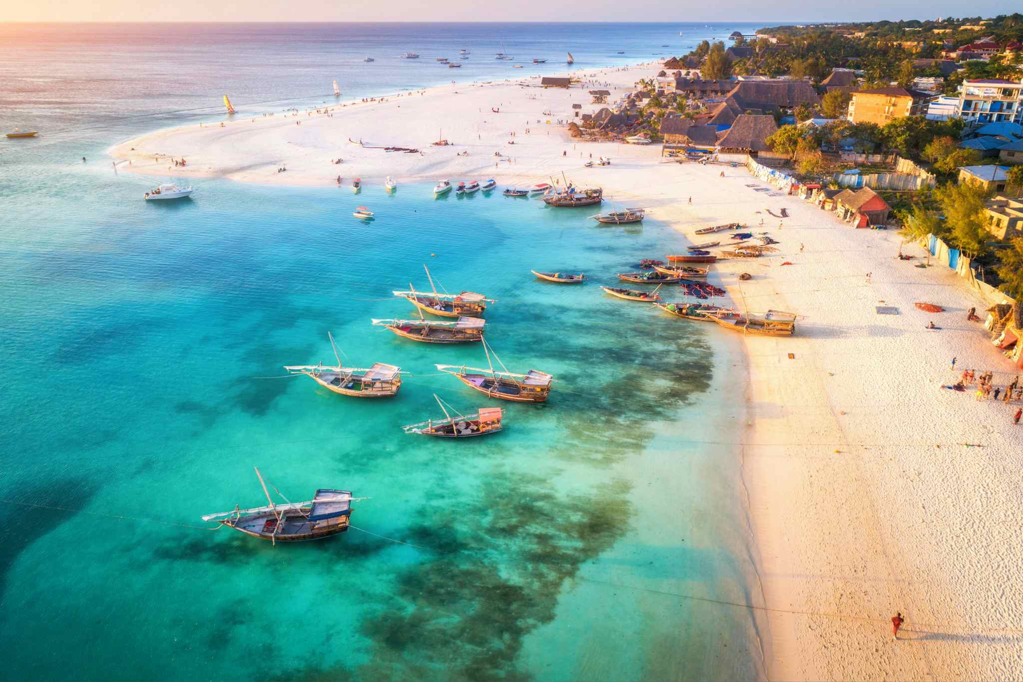 Aerial view of fishing boats by a sandy beach on the Indian Ocean, Zanzibar, Tanzania.
