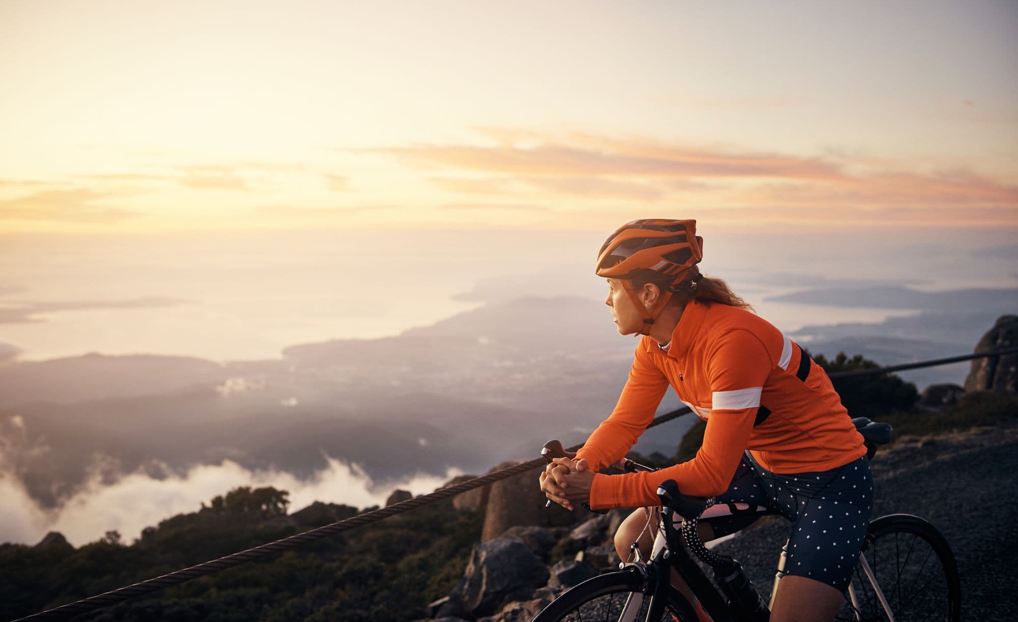A cyclist looks at a view
