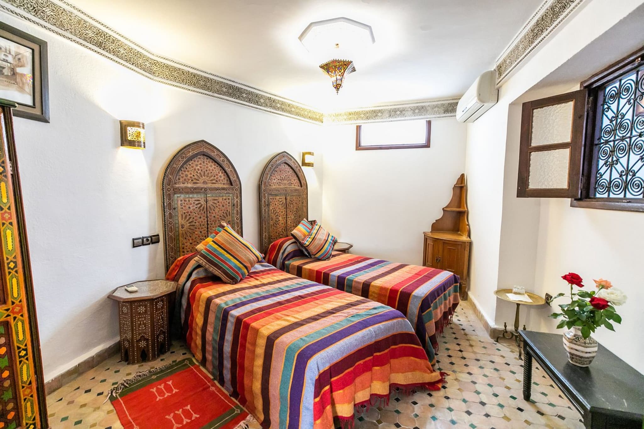 Twin Bedroom with Moroccan textiles at Riad Jardin Chrifa, Fes, Morocco
