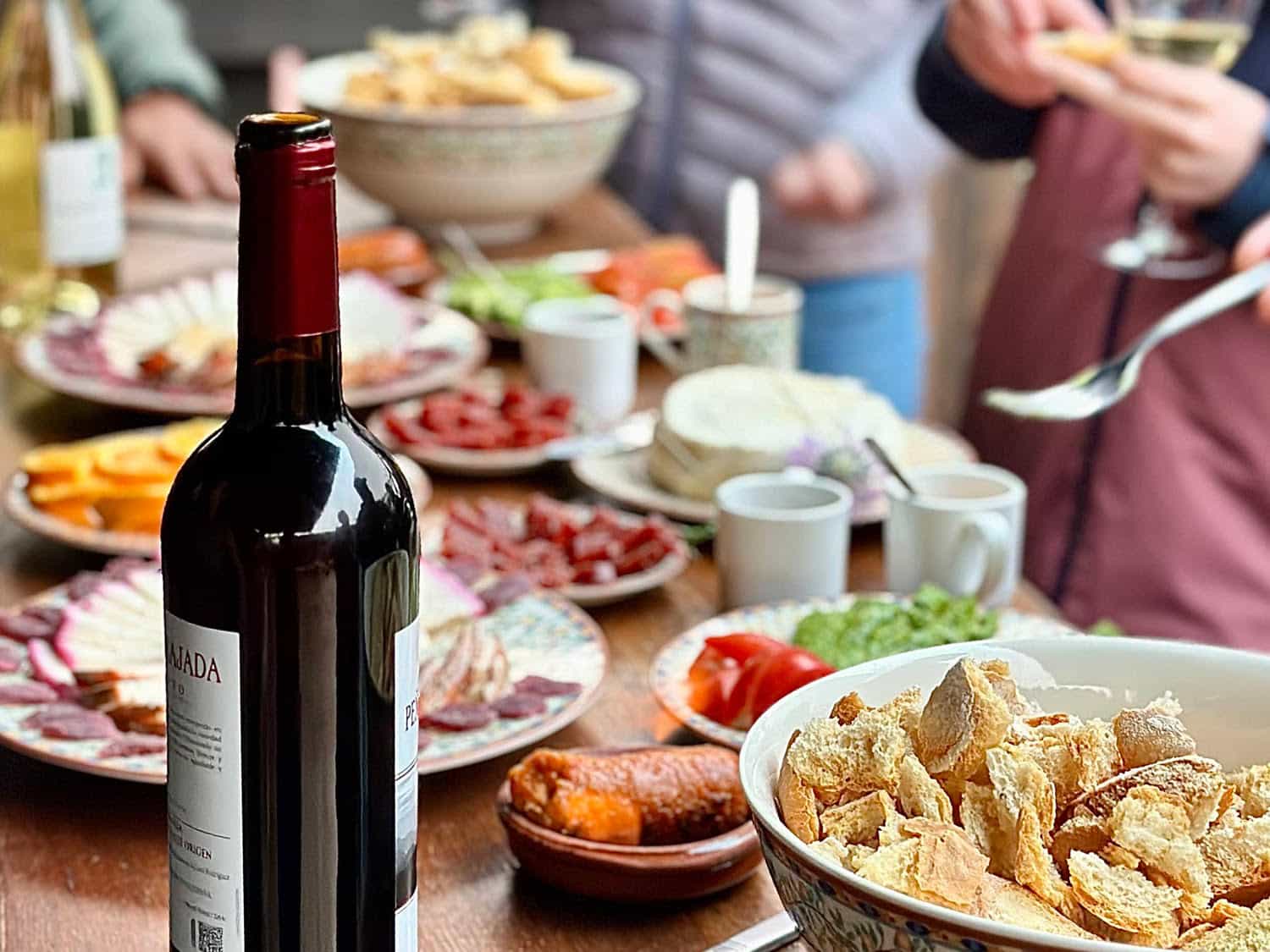 A table of food and wine.