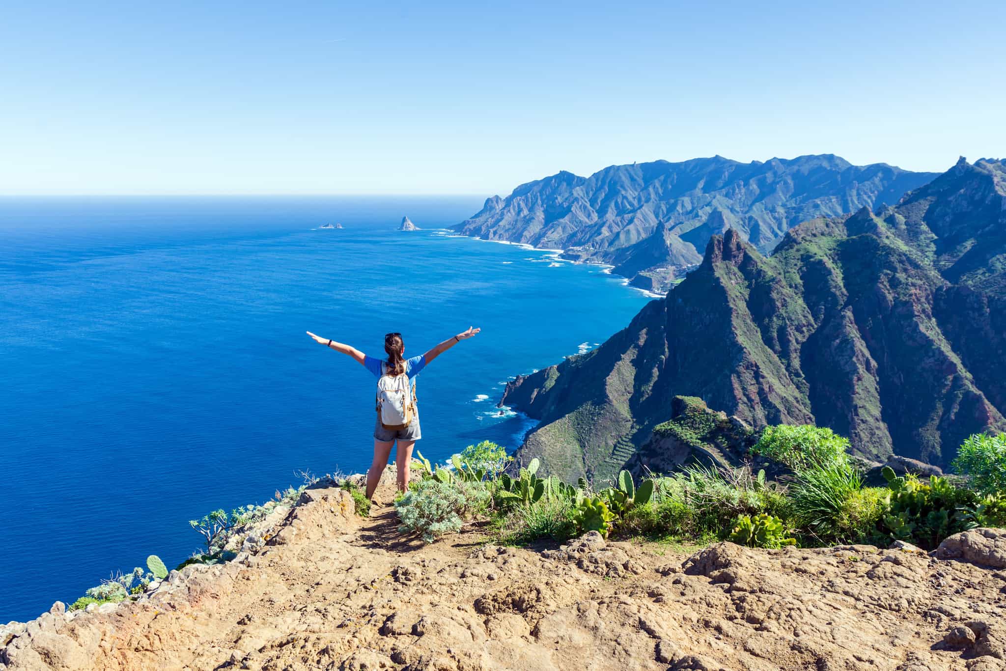 Girl overlooking the Atlantic Ocean in Anaga, Tenerife, Shutterstock.