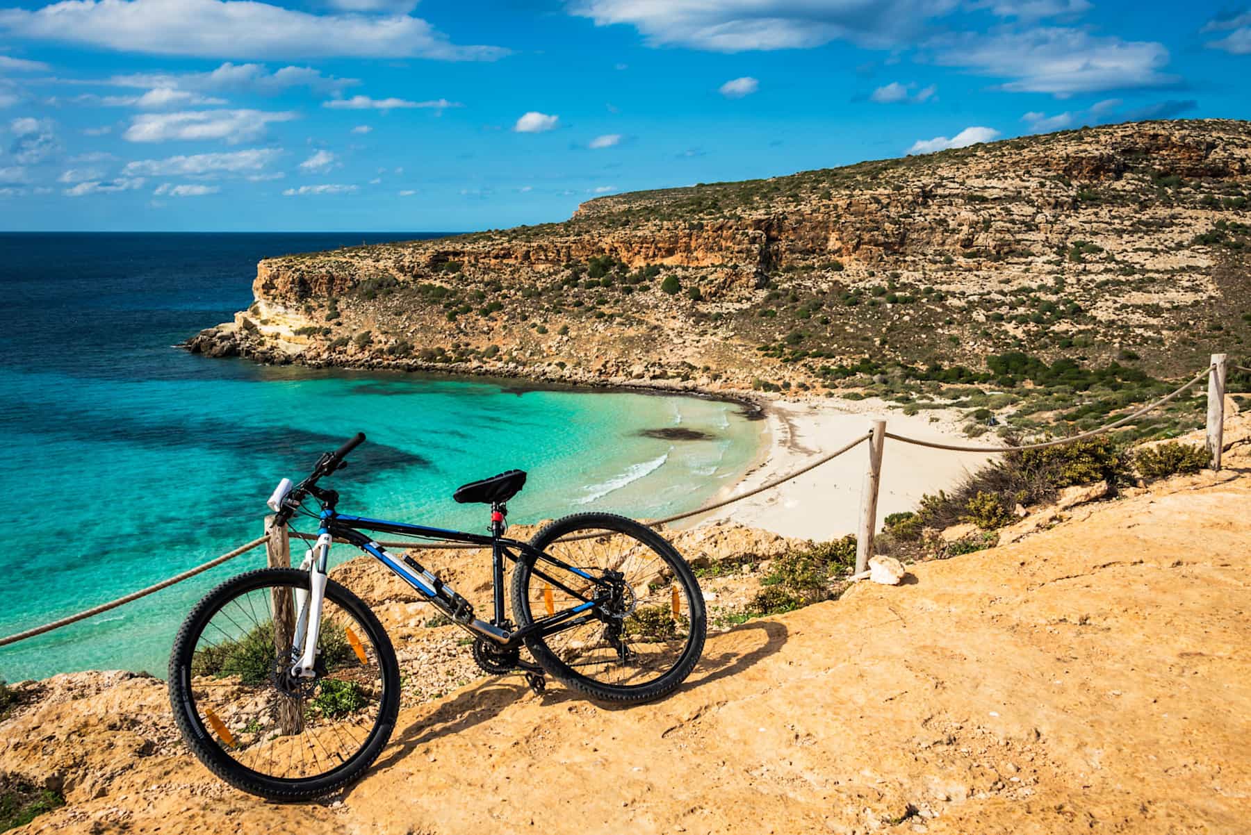 Bike with view of Sicily coastline & beach