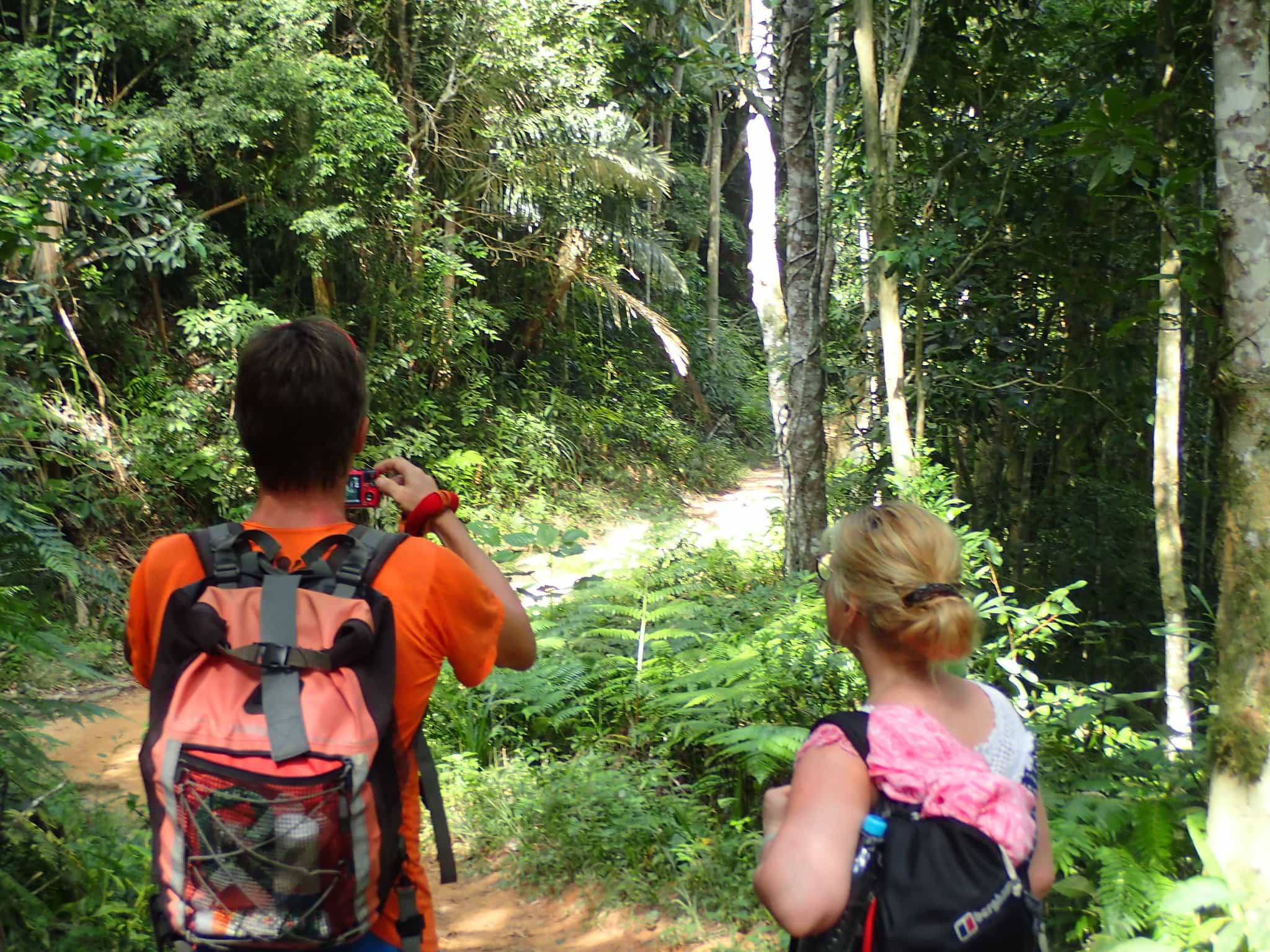 Hikers on the trail to Ponta Negra in Brazil