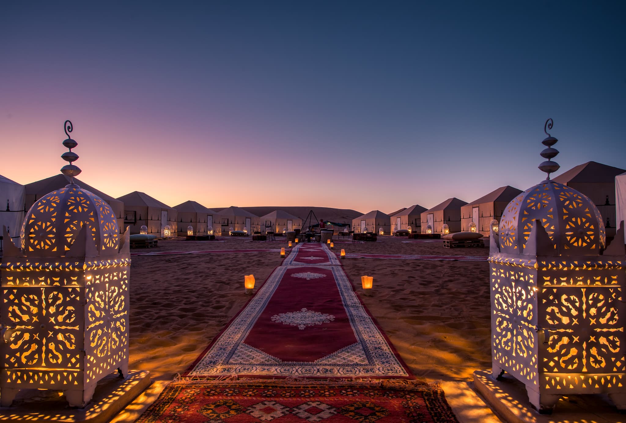 Sunset over tents at Azaward Luxury Desert Camp in the Sahara, Morocco