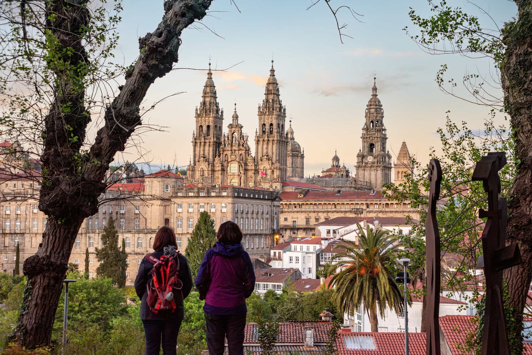 Hikers overlooking Santiago de Compostela, Spain.