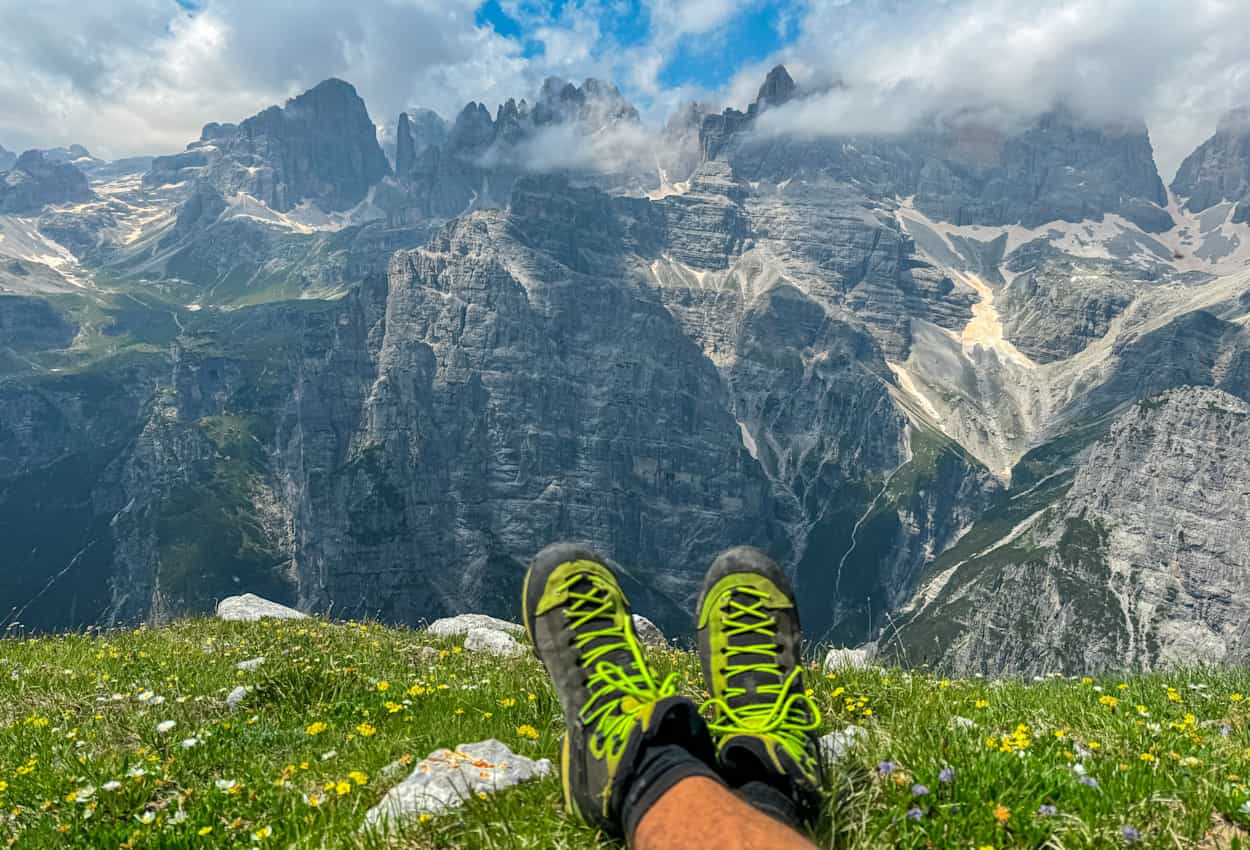 Hiking boots and mountain views of Dolomites