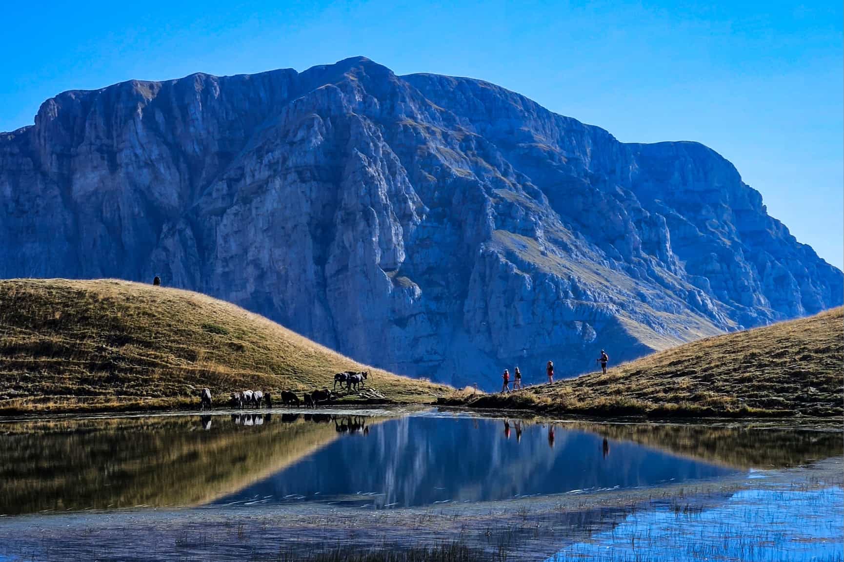 HOST - Trekkers at Dragon Lake in the Pindus Mountains, Greece. Photo: Host/Nomads Path