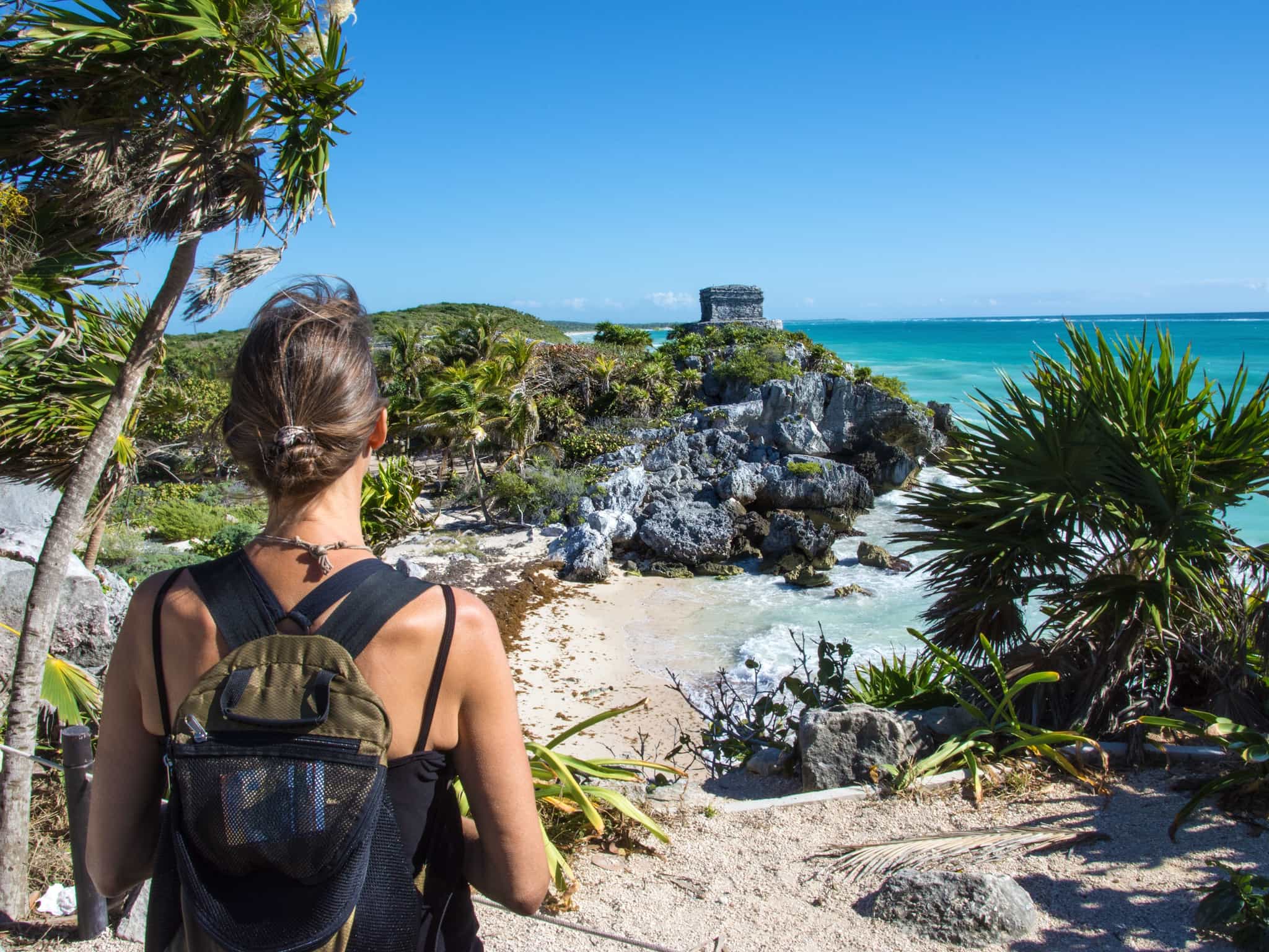 Traveller stading by Tulum Ruins, Mexico