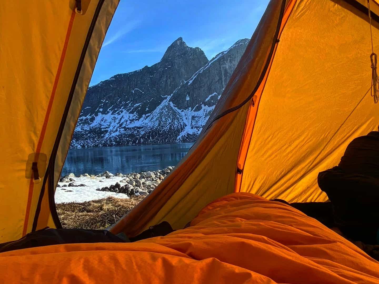 Peering out of the tent at Ravens Nest, Itisoq, Greenland.