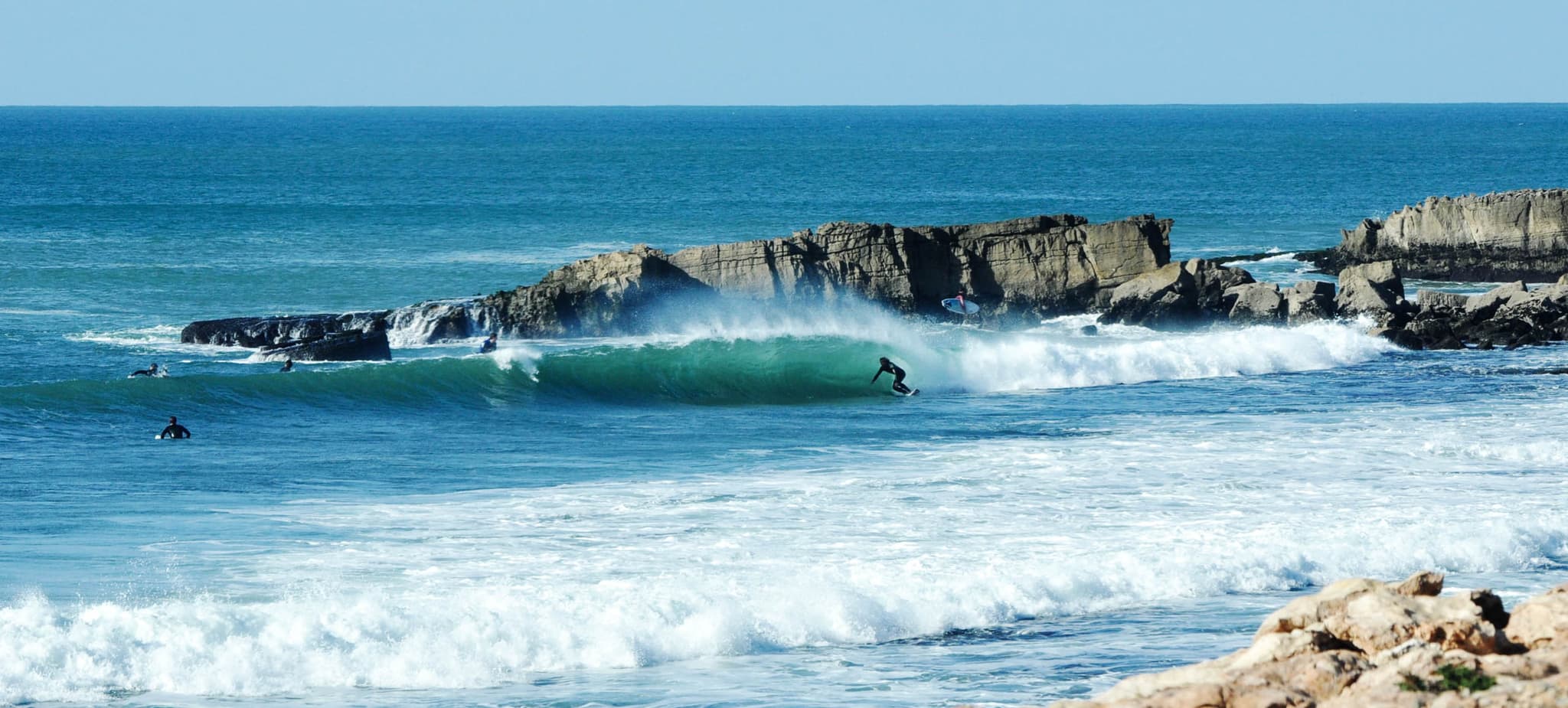 Surfing near rocks