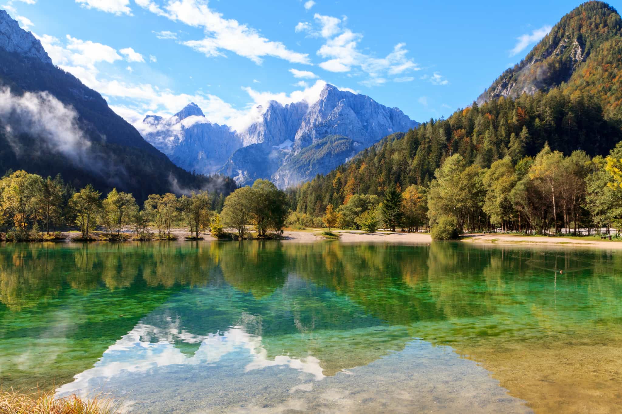 Beautiful emerald lake beneath the Slovenian Mountains